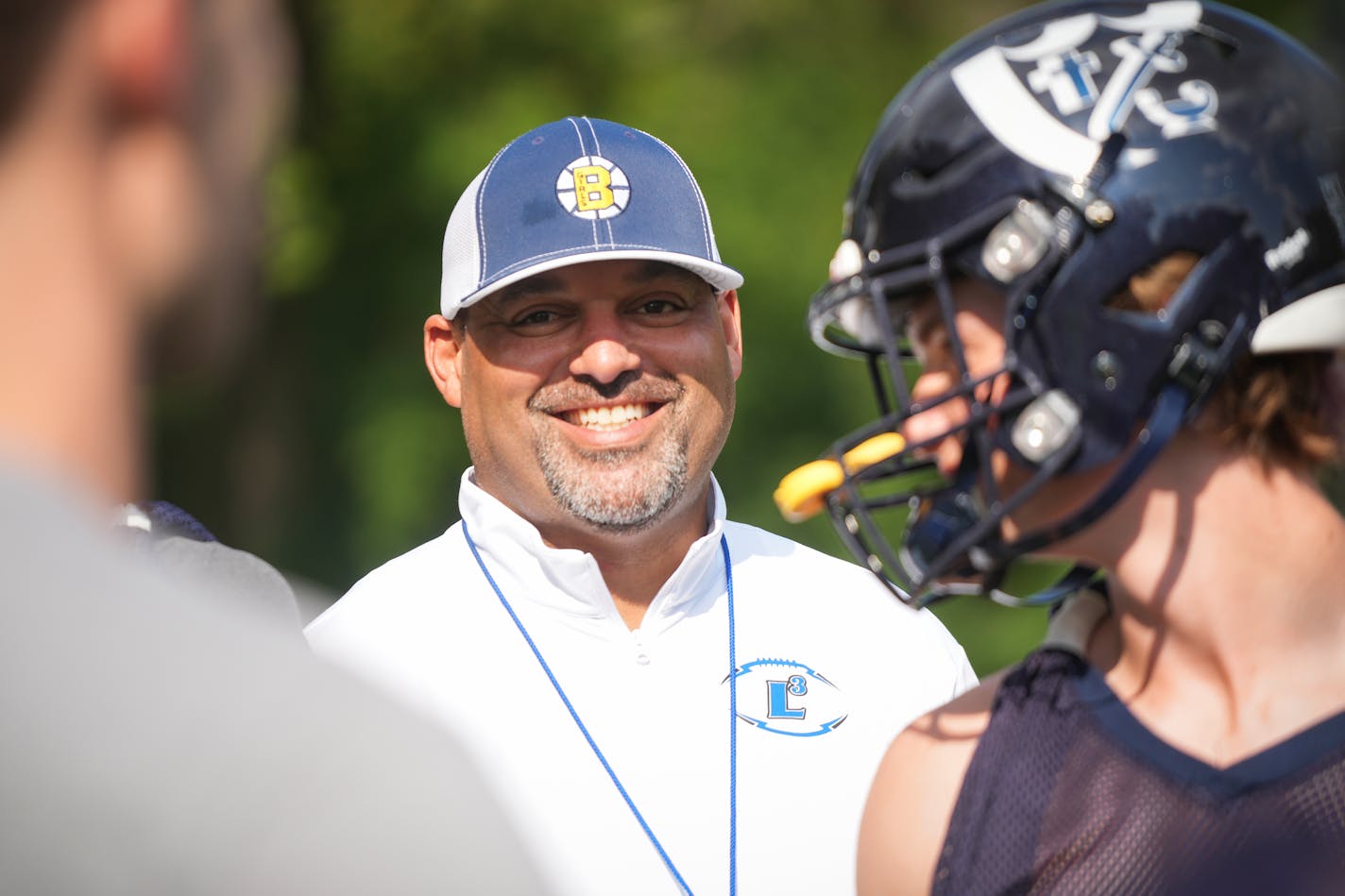 First-year coach Marcus Harris works with his players during Breck football practice, Tuesday, Sept. 6, 2022 in Golden Valley, Minn. ] SHARI L. GROSS / shari.gross@startribune.com