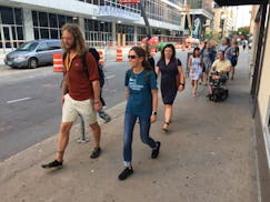Jonathan Stalls and Gosia Kung lead a group through downtown St. Paul on their way to dinner, after a day discussing walking issues at the National Wa