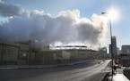 Steam from the the Hennepin Energy Recovery Center (HERC) waste-to-energy facility hangs above N. 7th Street in 2015.