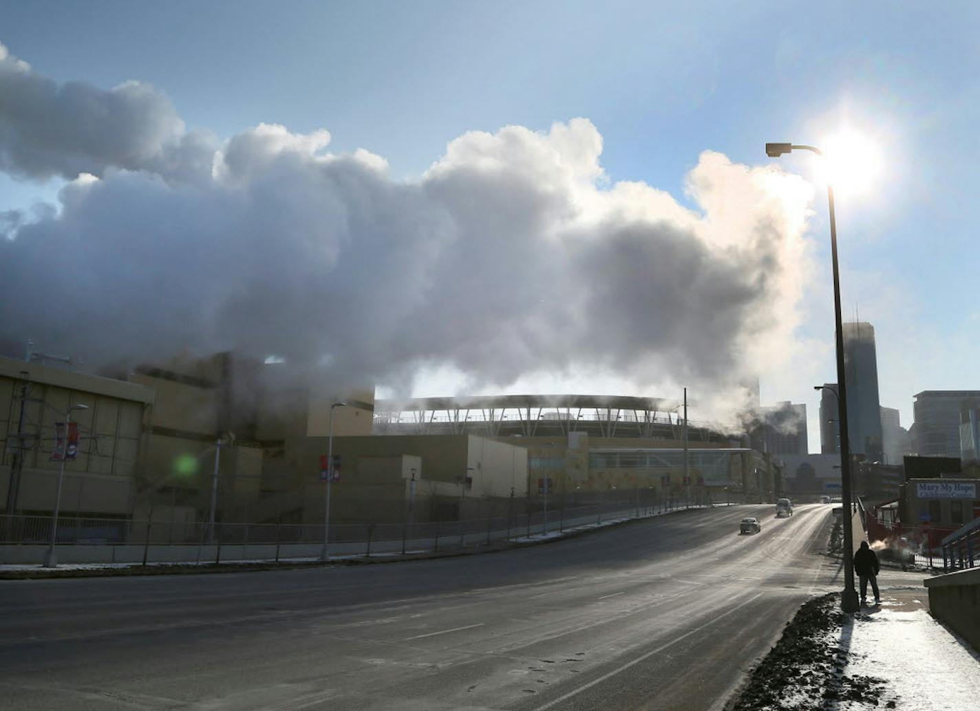 Steam from the the Hennepin Energy Recovery Center (HERC) waste-to-energy facility hangs above N. 7th Street in 2015.