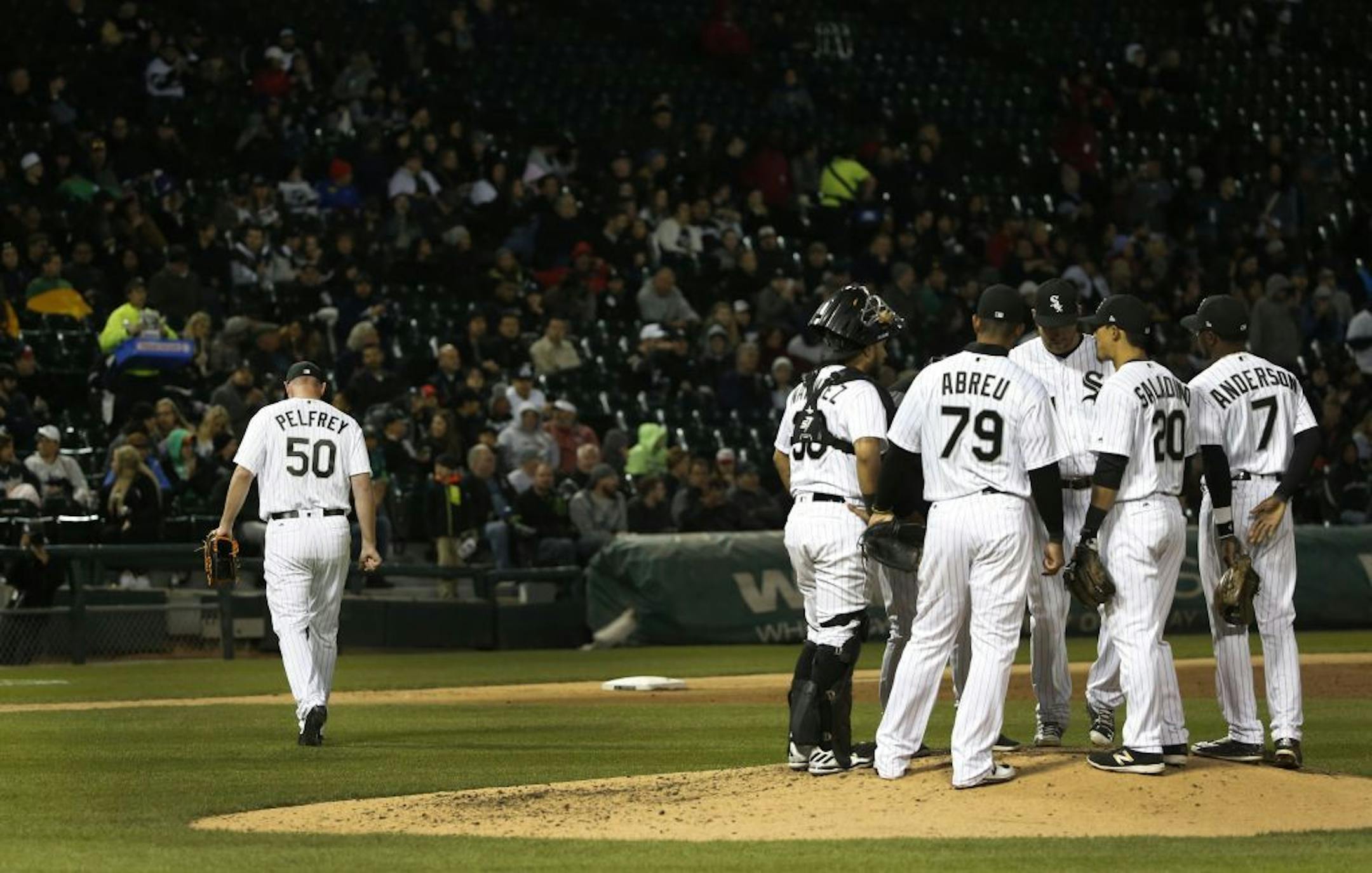 Chicago White Sox starting pitcher Mike Pelfrey, left, heads to the dugout after being taken out of the baseball game by manager Rick Renteria, during the fifth inning against the Minnesota Twins on Tuesday, May 9, 2017, in Chicago.