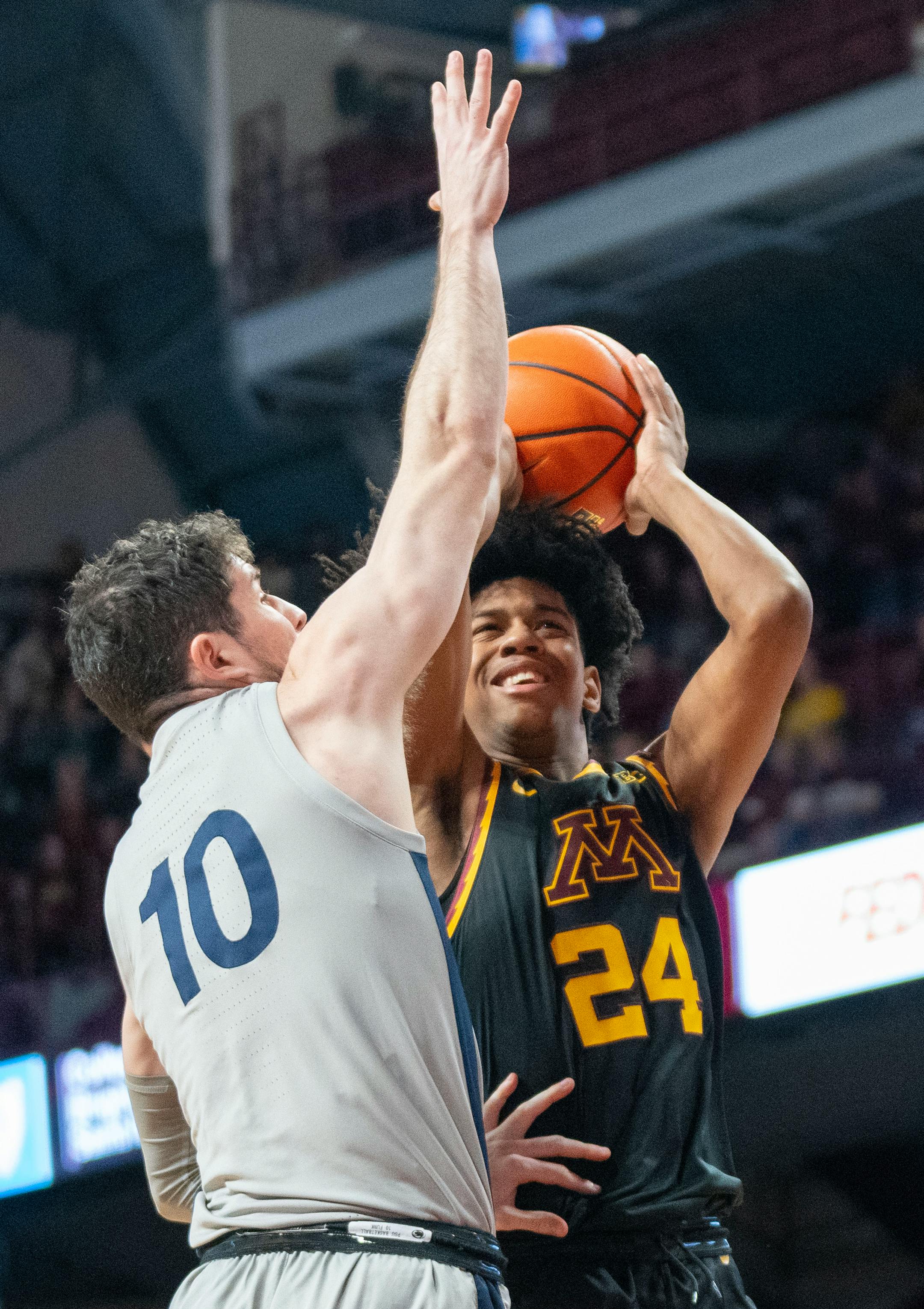 Penn State guard Andrew Funk (10) defends a shot attempt by Minnesota forward Jaden Henley (24) in the first half.