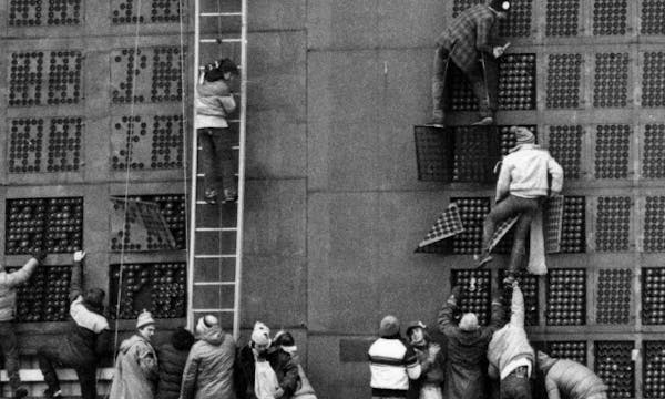 Vikings fans in search of souvenirs climbed the scoreboard after the final NFL game at Metropolitan Stadium on Dec. 20, 1981.