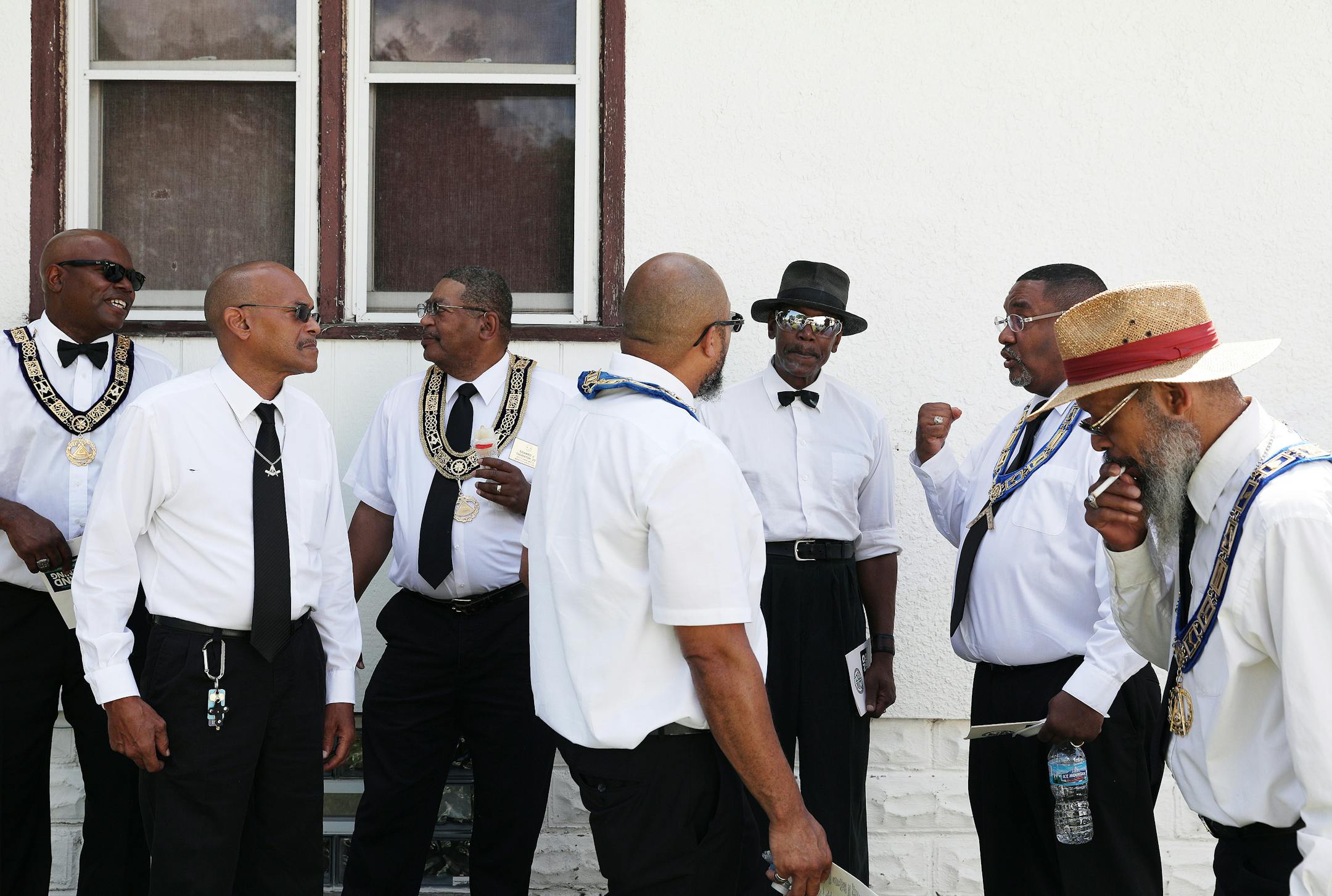 Prince Hall Masons stood in the shade to keep cool during the grand opening ceremony. ] ANTHONY SOUFFLE • anthony.souffle@startribune.com  Officials held a grand opening for the Rondo Commemorative Plaza July 14, 2018 in St. Paul.