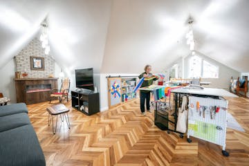 Carolyn Davidson worked on the cutting table in her new quilt room.