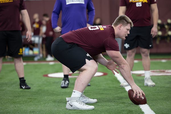 Center John Michael Schmitz working out at the Gophers Pro Day. 