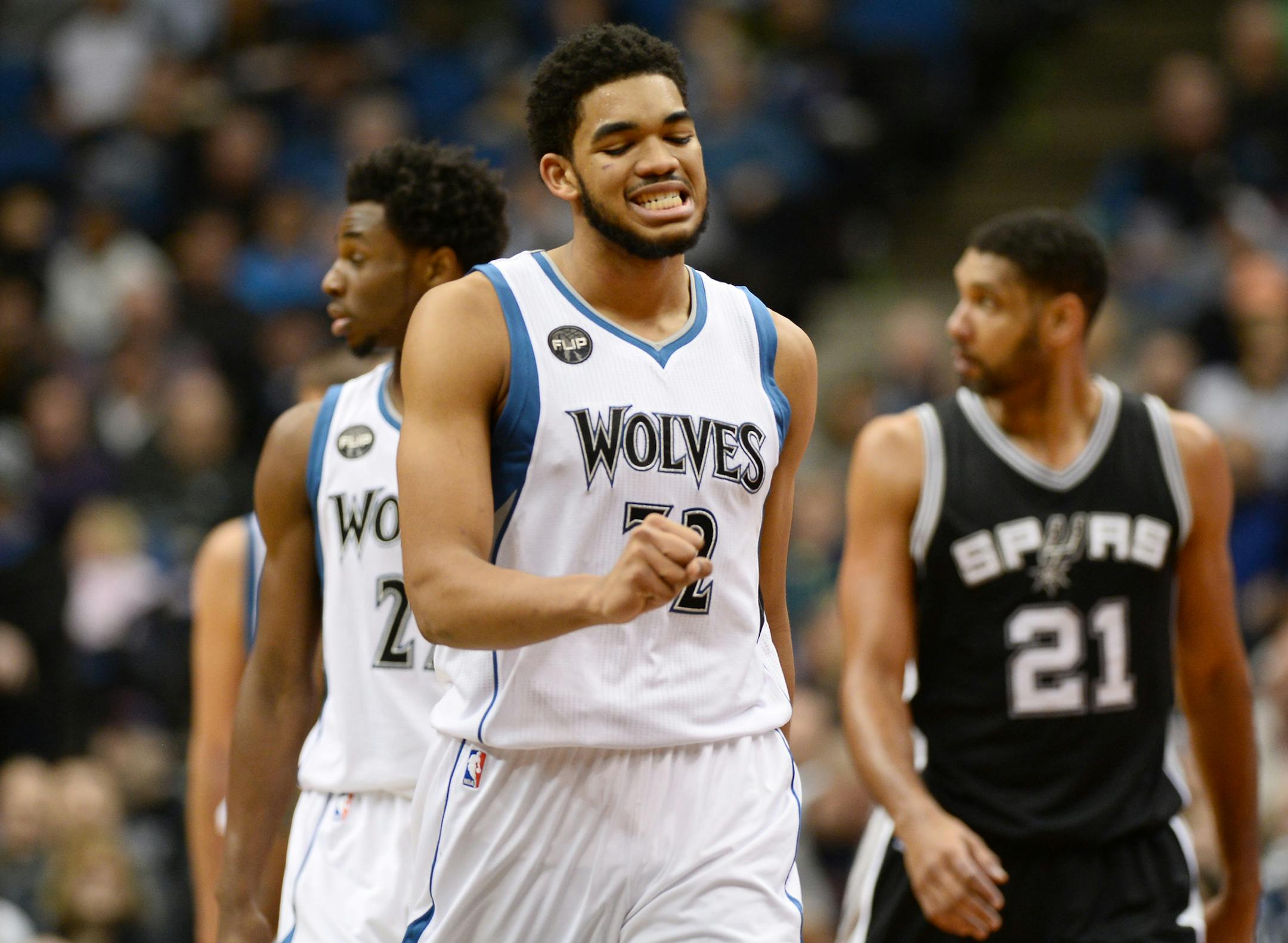 Minnesota Timberwolves center Karl-Anthony Towns (32) reacted after committing an offensive foul against the Spurs.
