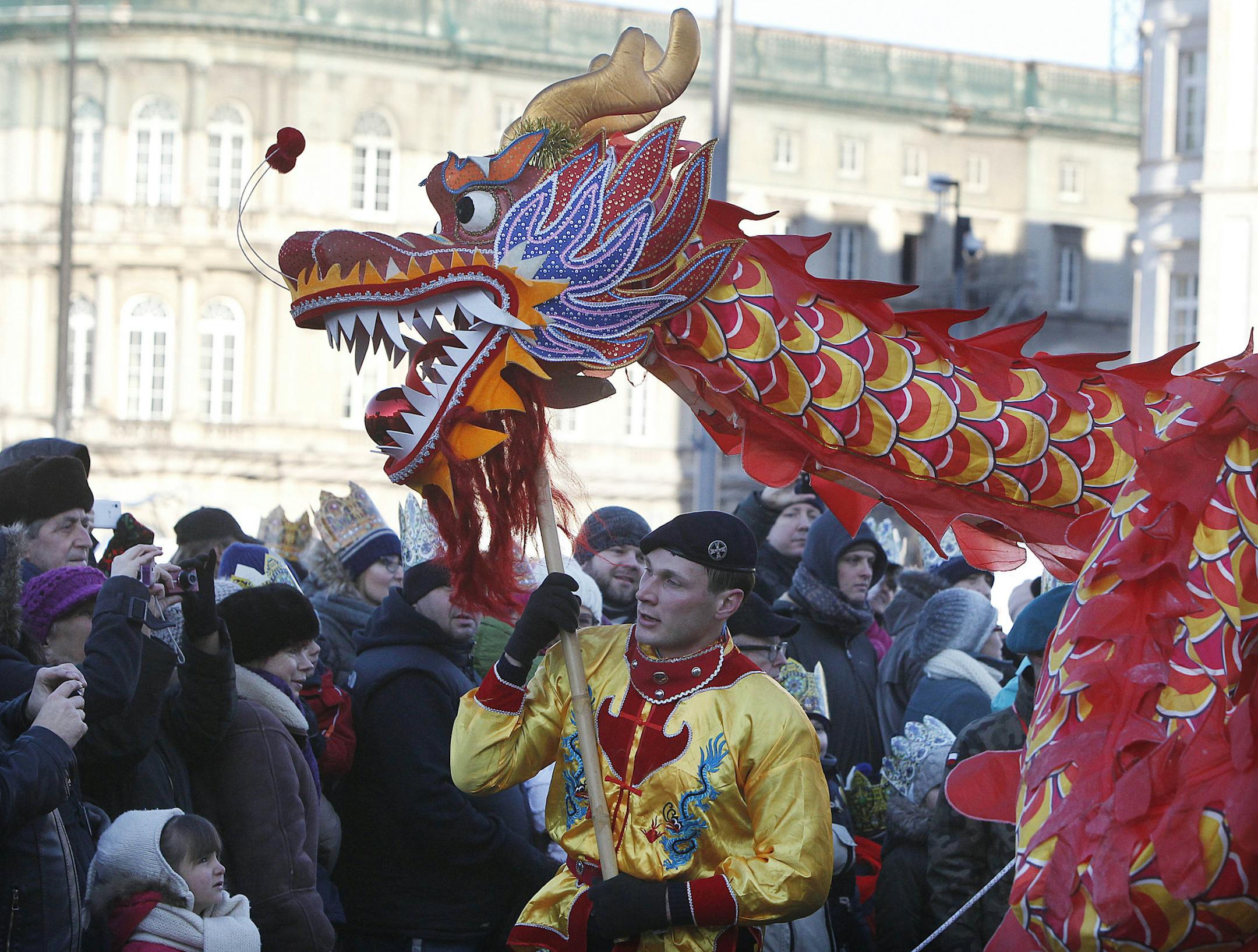 A dragon is carried during the traditional Roman Catholic Epiphany procession the streets of Warsaw, Poland, Tuesday, Jan. 6, 2015. (AP Photo/Czarek Sokolowski)