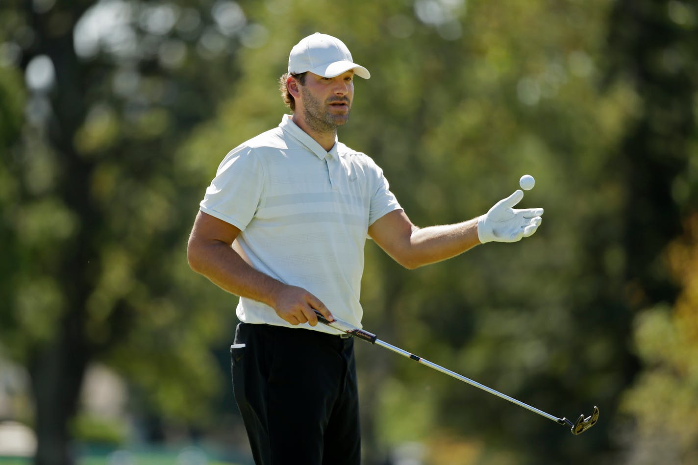 Tony Romo prepares to putt on the third green of the Silverado Resort North Course