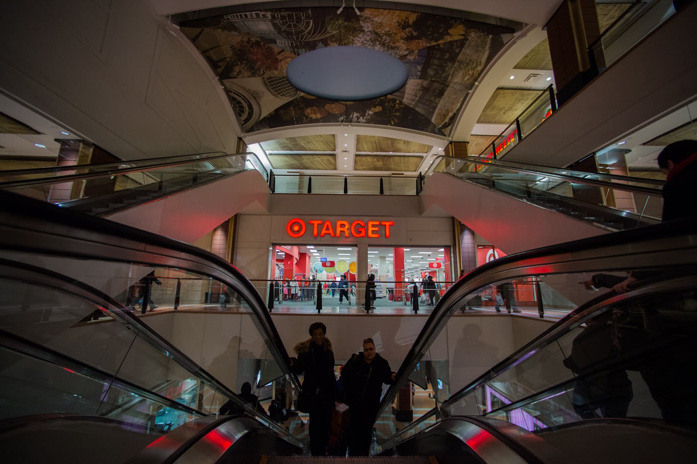 Shoppers ride escalators near a Target Corp. store at the Atlantic Terminal Mall in the Brooklyn borough of New York, U.S., on Friday, March 7, 2014. The U.S. Census Bureau is scheduled to release retail sales figures on March 13. Photographer: Craig Warga/Bloomberg