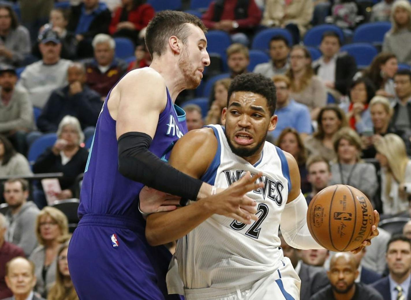 Minnesota Timberwolves' Karl-Anthony Towns, right, drives around Charlotte Hornets' Frank Kaminsky III in the first quarter of an NBA basketball game Tuesday, Nov. 15, 2016, in Minneapolis.