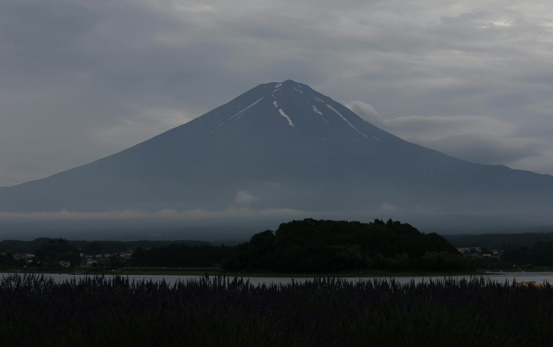 In this Wednesday, July 3, 2013 photo, Mount Fuji is seen in early morning in Kawaguchiko town, Yamanashi prefecture, Japan. Japan's most iconic landmark, the 3,776-meter-tall Mount Fuji, was selected as a World Heritage site in June.