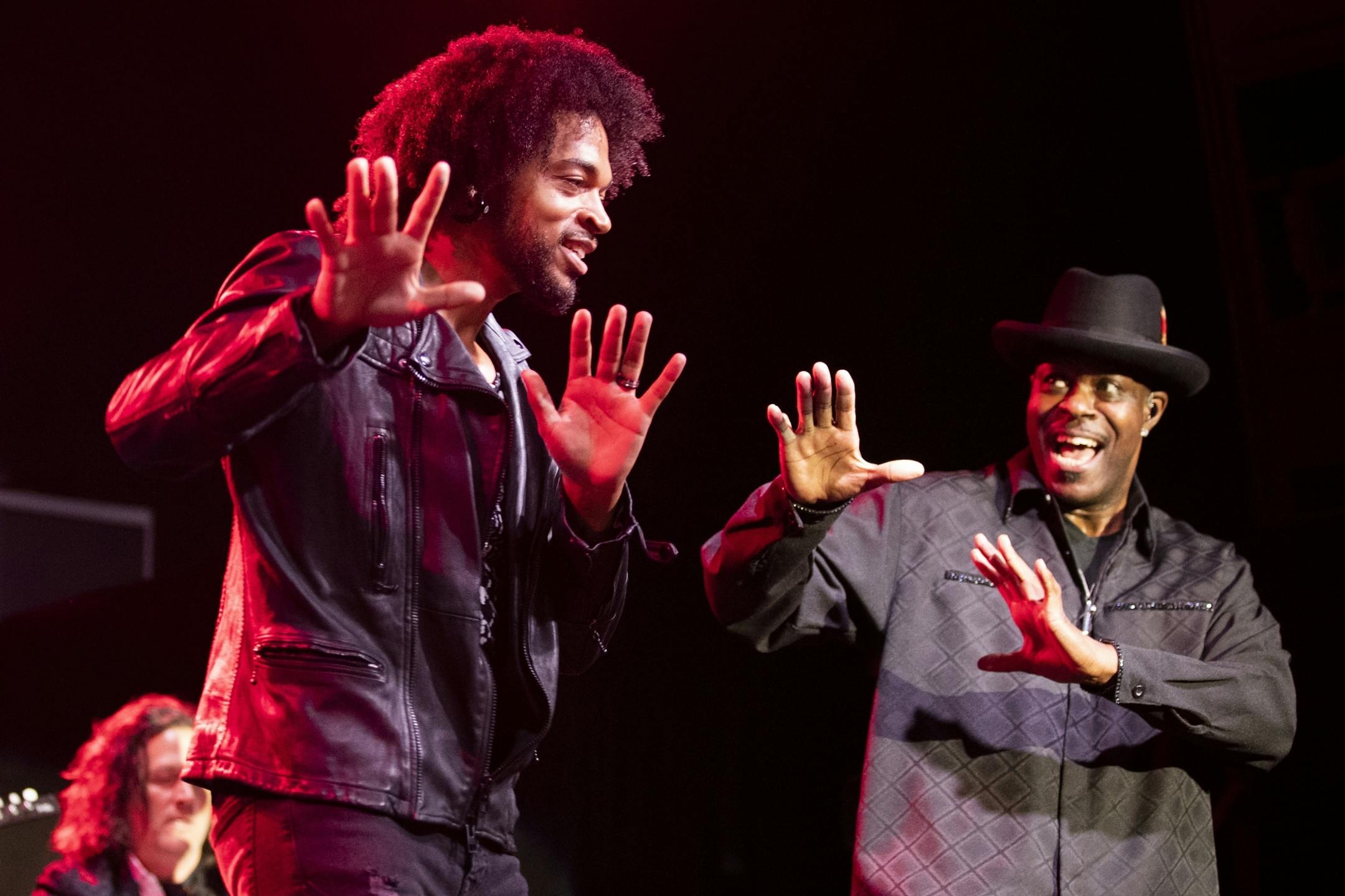 MacKenzie sings lead vocals, with Damon Dixon at right, during the New Power Generation show.