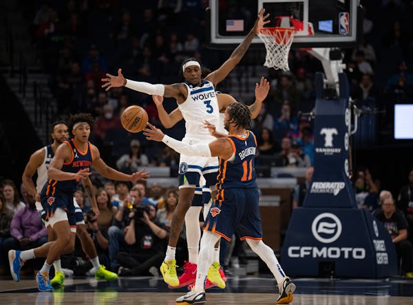 Minnesota Timberwolves forward Jaden McDaniels (3) defended a pass by New York Knicks guard Jalen Brunson (11) in the first quarter of their game Mond