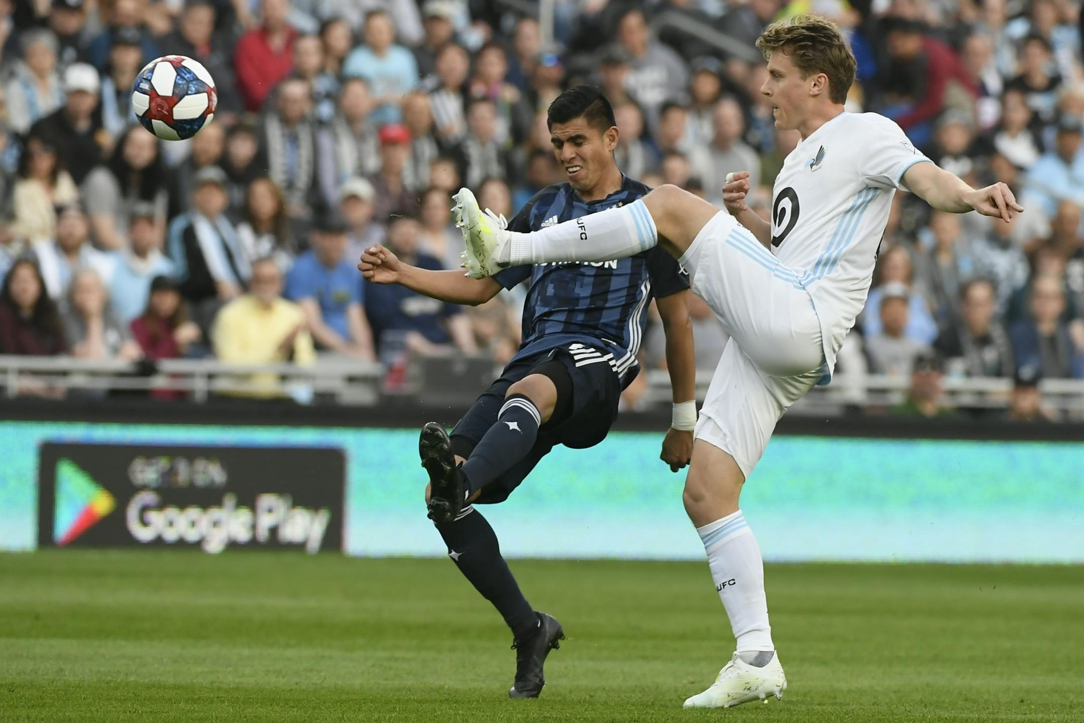 Los Angeles Galaxy midfielder Joe Corona, left, and Minnesota United midfielder Rasmus Schuller battled for the ball in April.