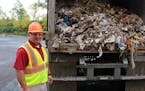 Ramsey/Washington Recycling & Energy Center Facility Manager Ryan Tritz stands in front of a truck loaded with refused-derived fuel, the final product