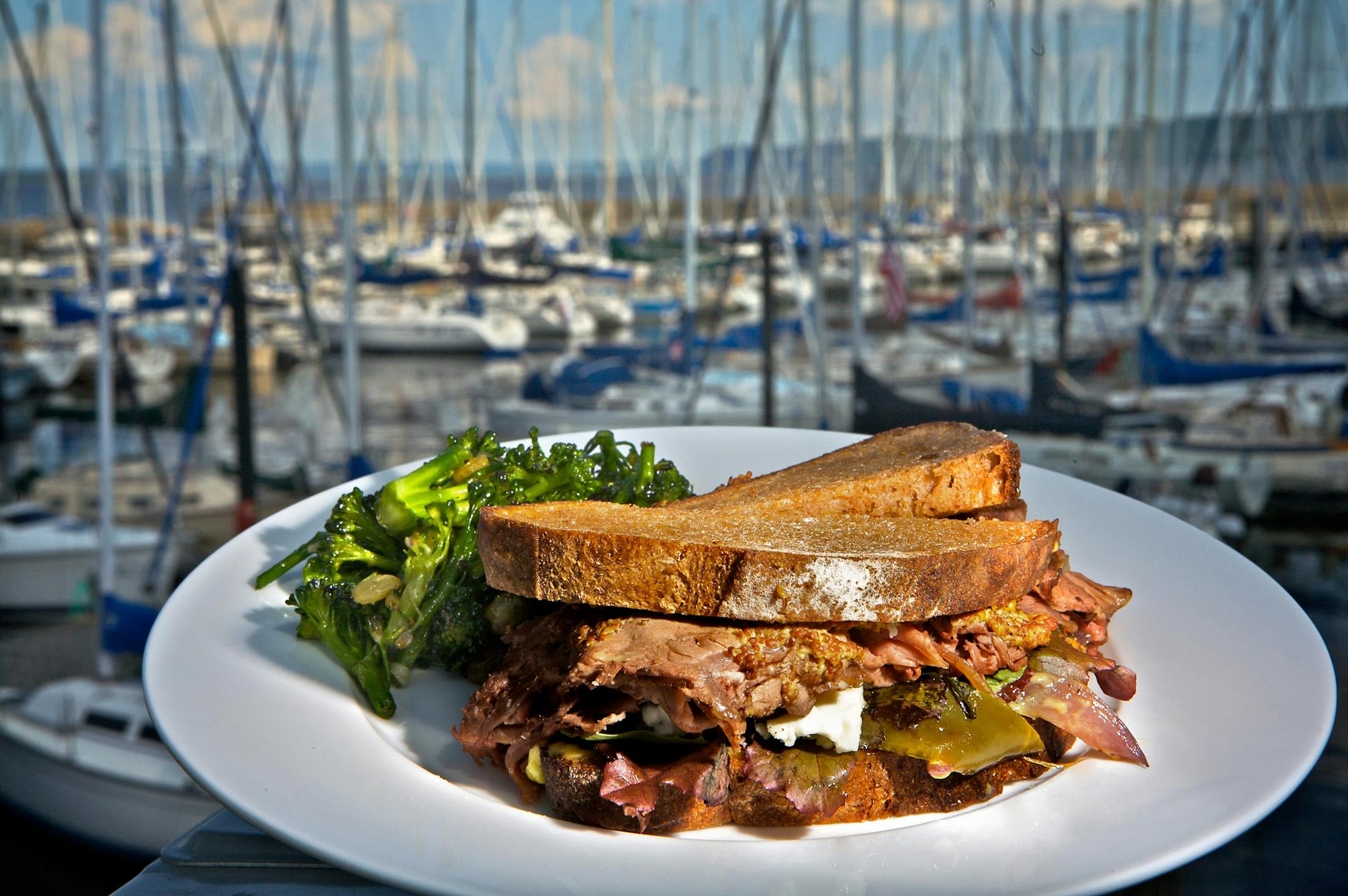 Rabbit Bakery's "roast beast" sandwich with the bakery's view of the Lake Pepin marina.