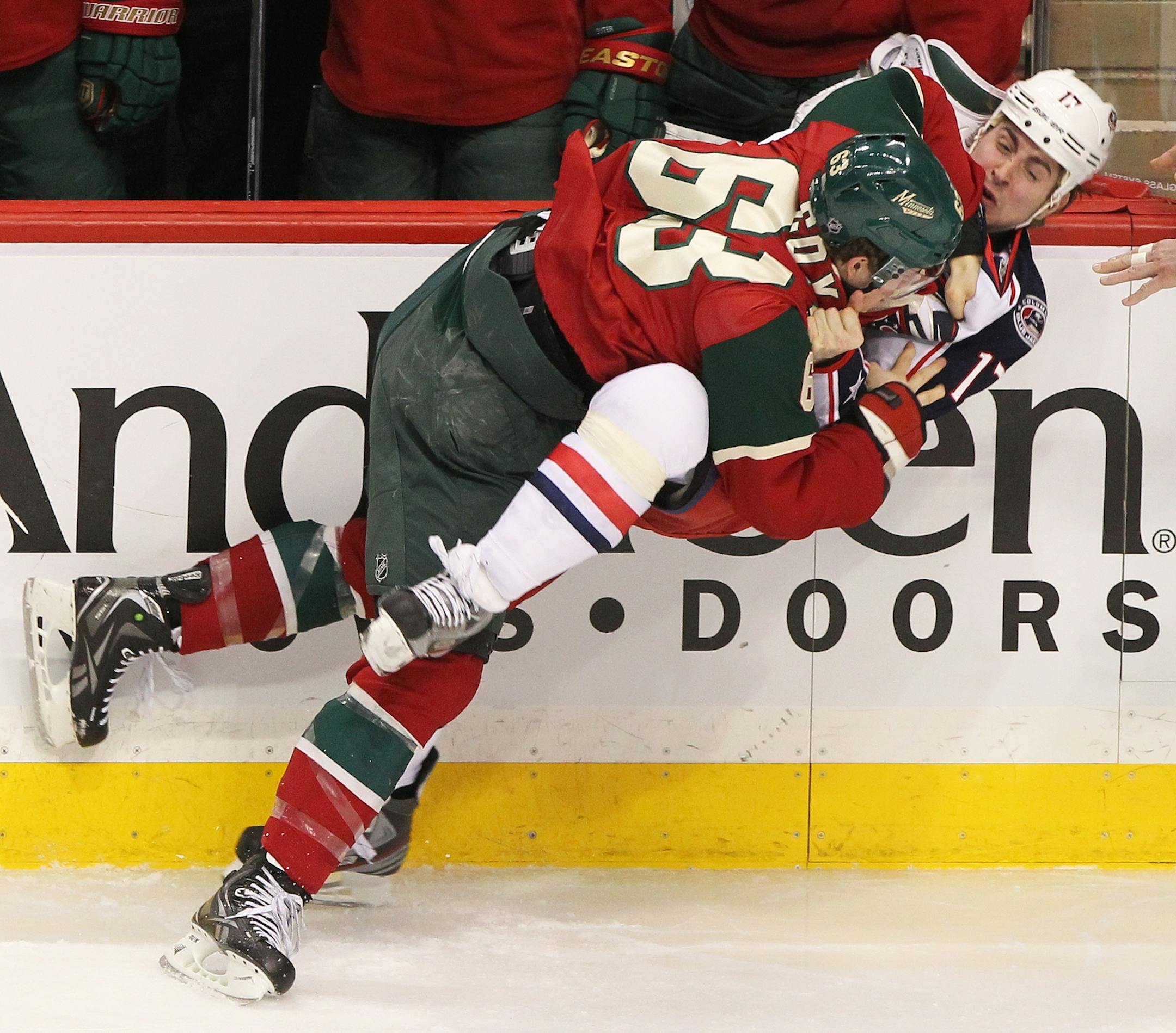 Charlie Coyle was ejected from the game for a check to the head. Here, he fought Brandon Dubinsky after the illegal check.