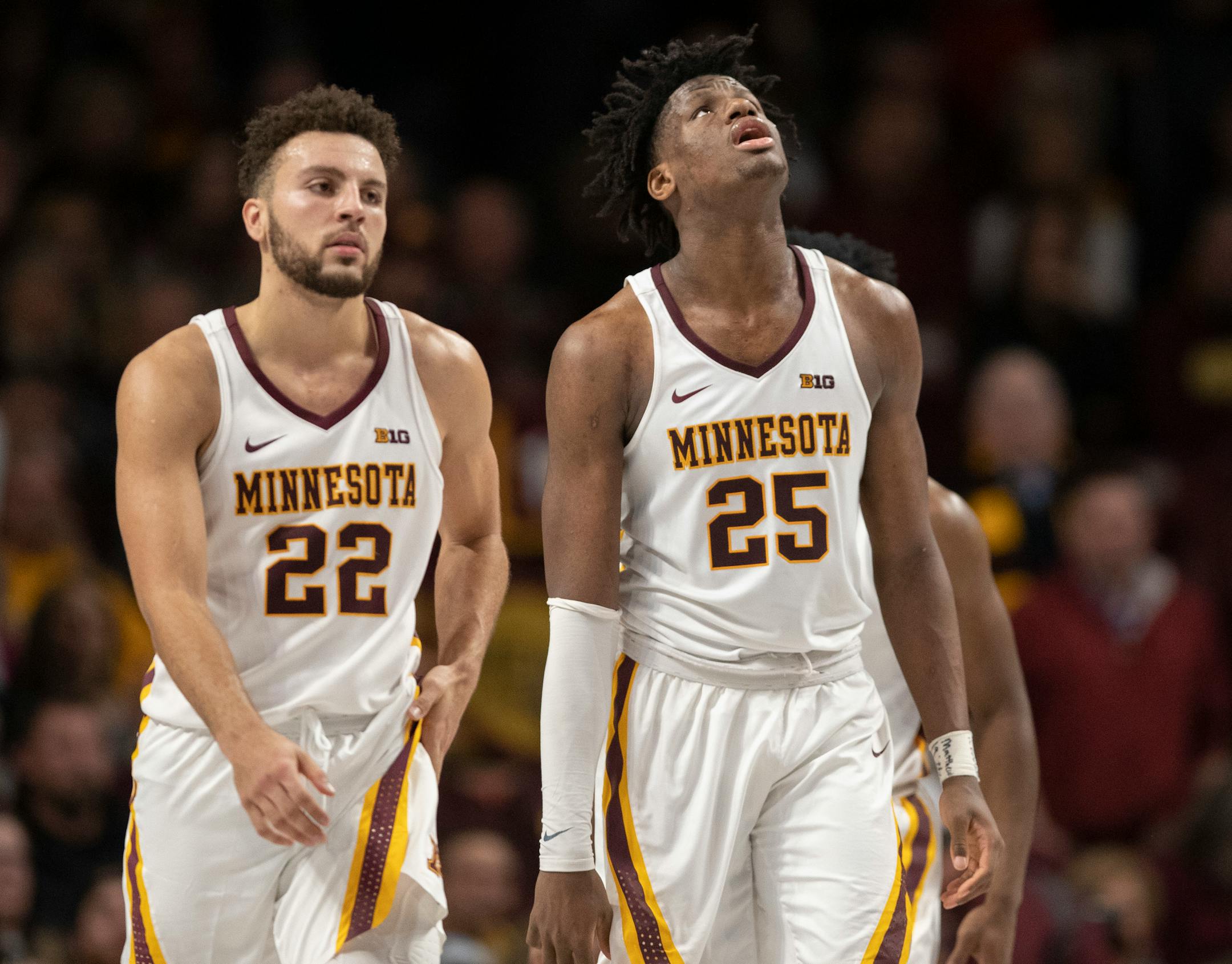 Gophers center Daniel Oturu (25) and guard Gabe Kalscheur (22) looked up at the scoreboard after missing a crucial free throw late in the second half.