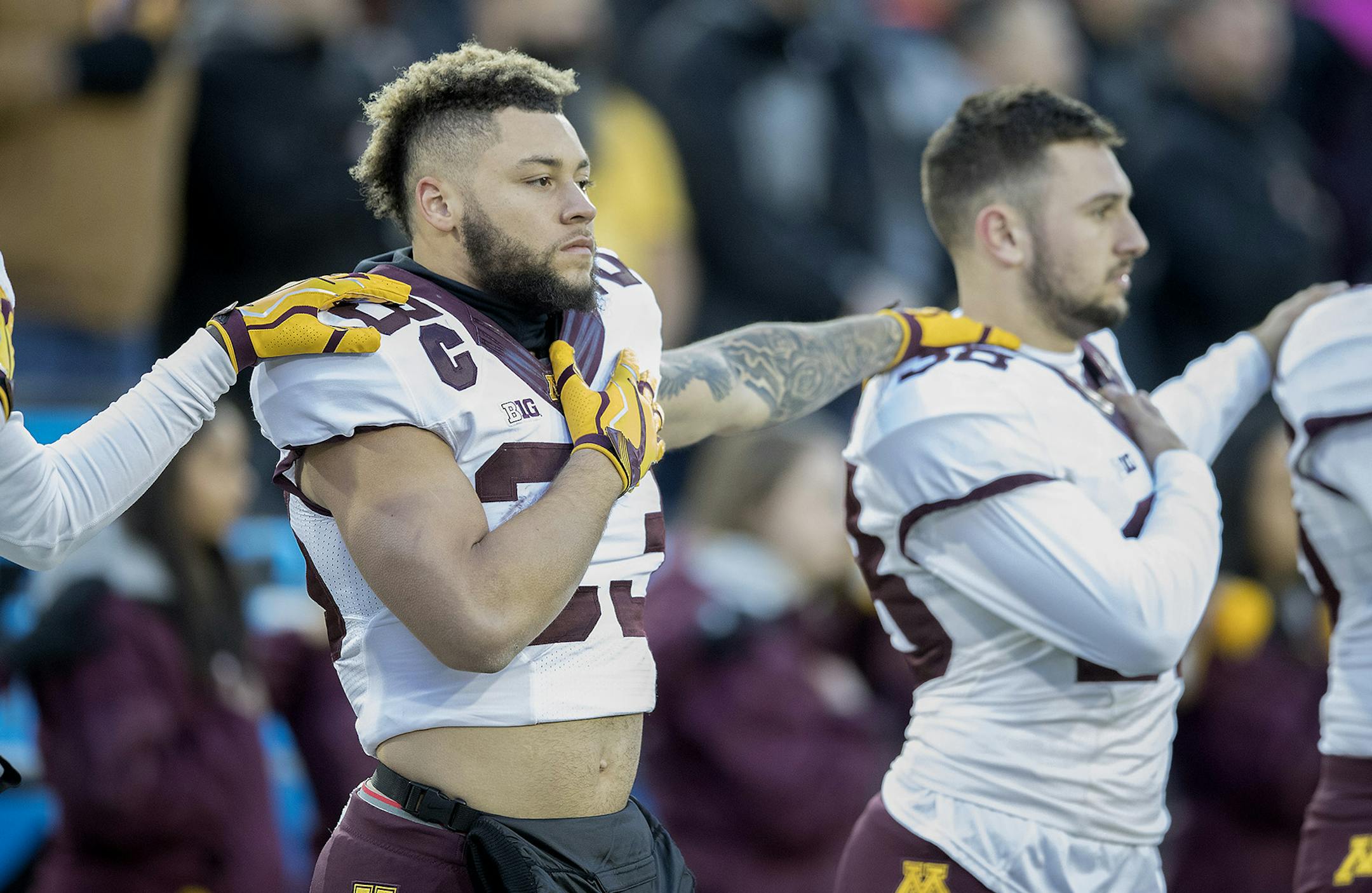 Minnesota's running back Shannon Brooks joined the team to stand for the National Anthem for the first time all season before Minnesota took on the Iowa Hawkeyes at Kinnick Stadium, Saturday, October 28, 2017 in Iowa City, IA. ] ELIZABETH FLORES &#xef; liz.flores@startribune.com