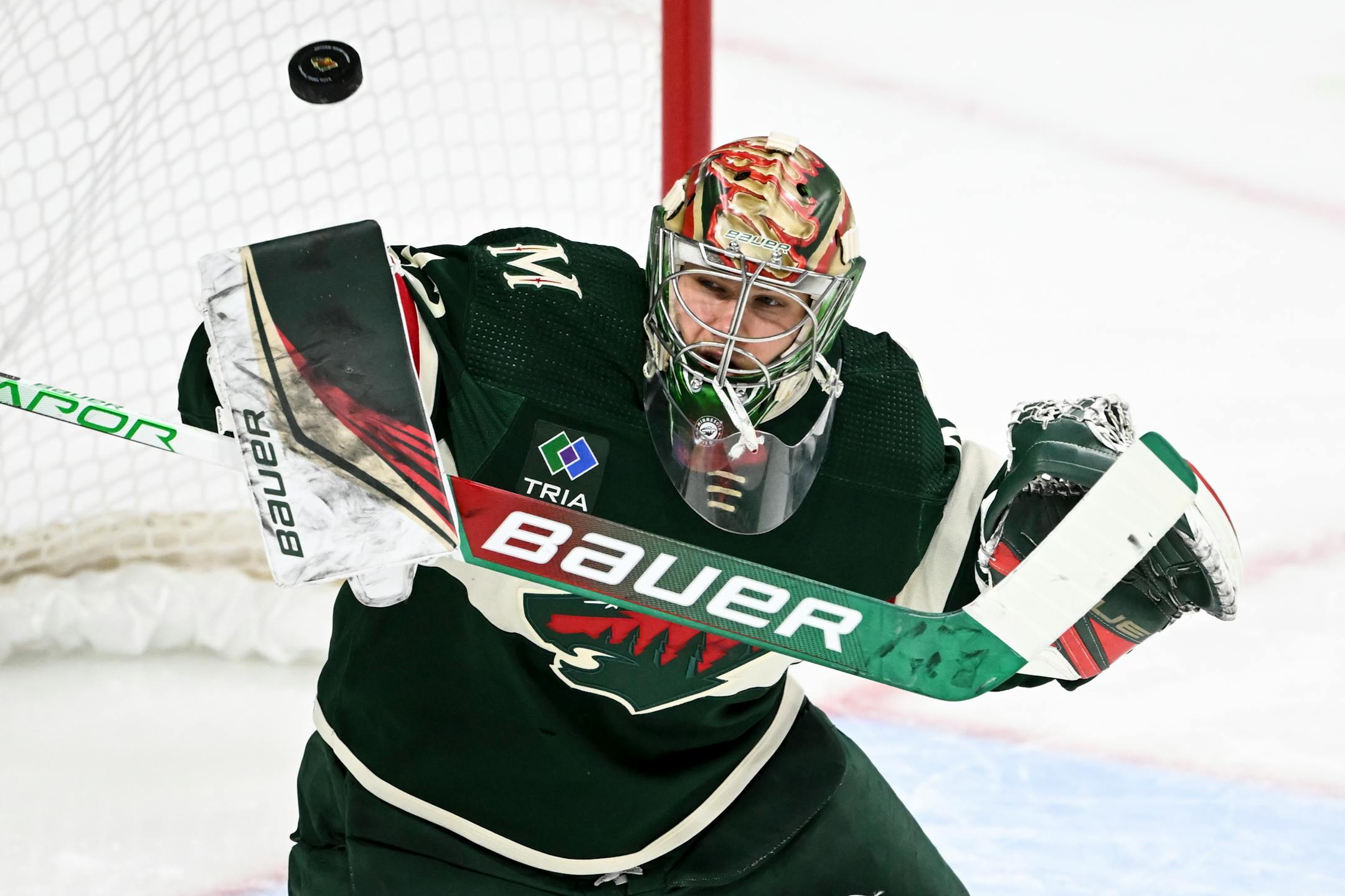 Minnesota Wild goaltender Filip Gustavsson (32) makes a save against Calgary Flames during the third period.