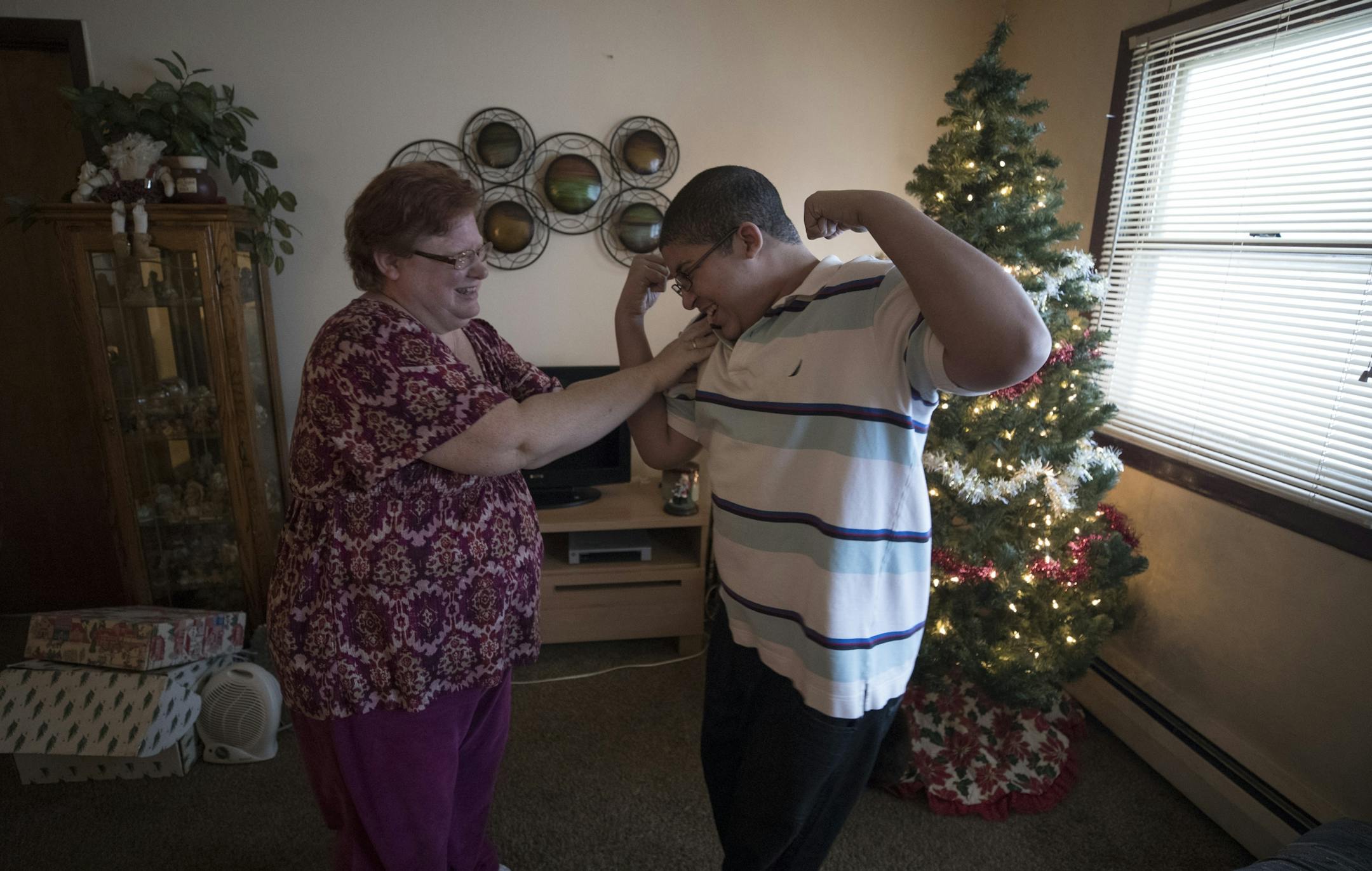 Cora Mustin played with her15-year-old son Jordan Mustin in their apartment after he arrived home from school Thursday December 14, 2017 in Mounds View, MN. Jordan has autism and a history of violent outbursts toward himself and family.