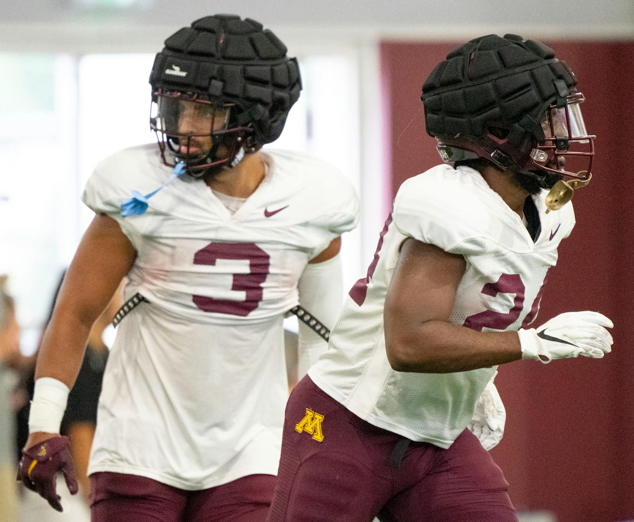Gophers running backs Trey Potts (3) and Mohamed Ibrahim (24) run towards the next drill during the football team's open practice SaturdaySaturday, August 6, 2022 in the Gibson/Nagurski Football Practice Facility.