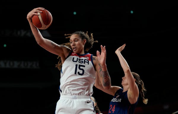 United States' Brittney Griner grabs a rebound ahead of Serbia's Maja Skoric during a women's basketball semifinal game at the 2020 Summer Olympics