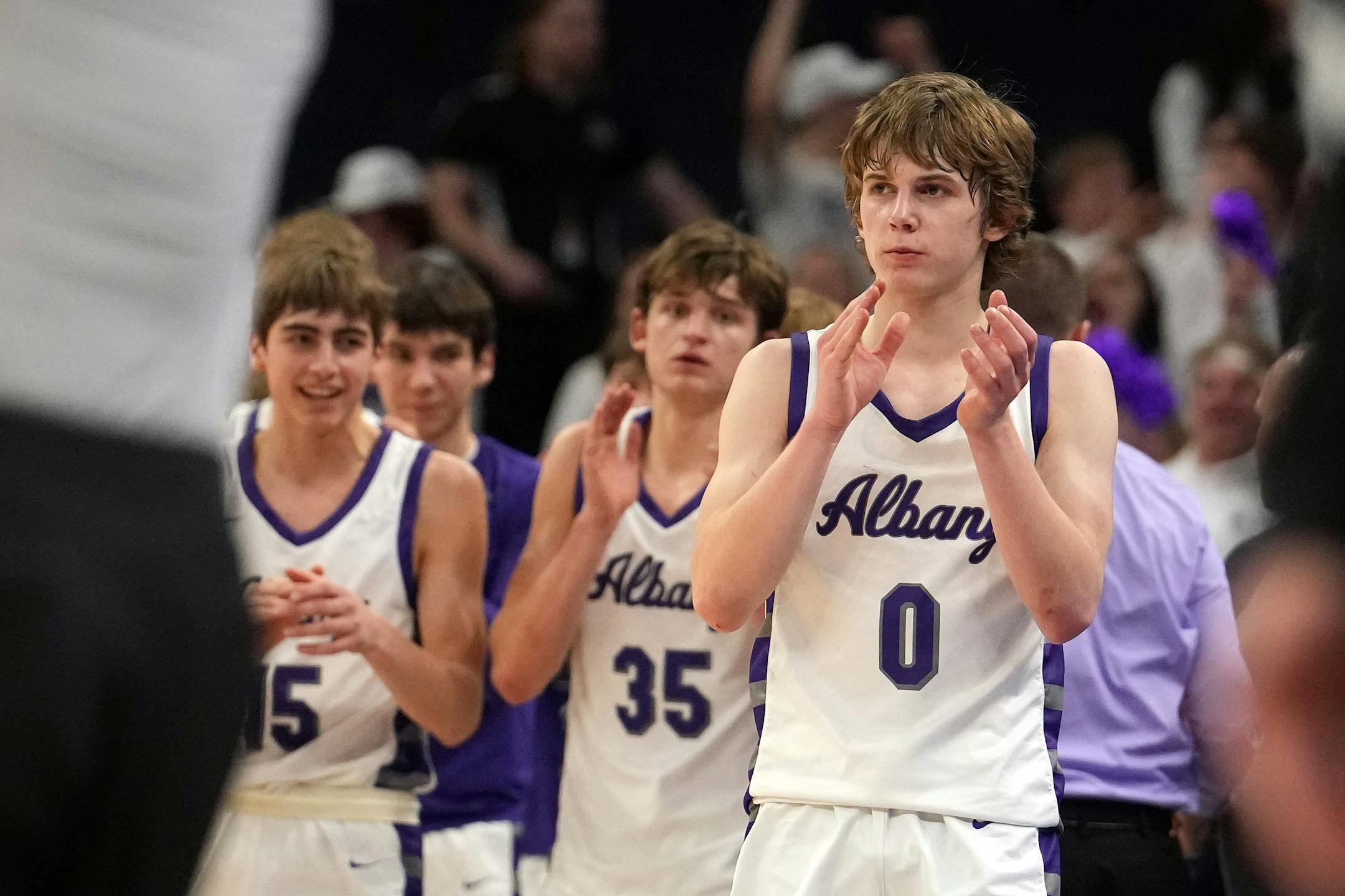 Albany guard Zeke Austin (0) celebrates their win as time expires in the second half.