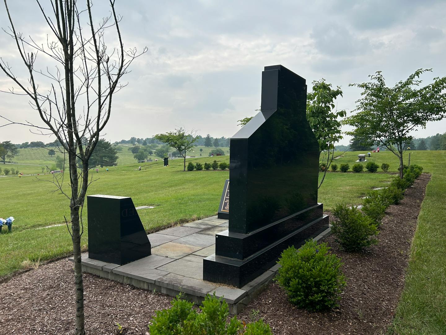 Seven miles southwest of the Northup-Reed monument in National Harmony Memorial Park in Landover, Md., the U.S. Capitol dome carries the Statue of Freedom, obscured here by clouds and smoke from wildfires in Canada. MUST CREDIT: Washington Post photo by Gillian Brockell