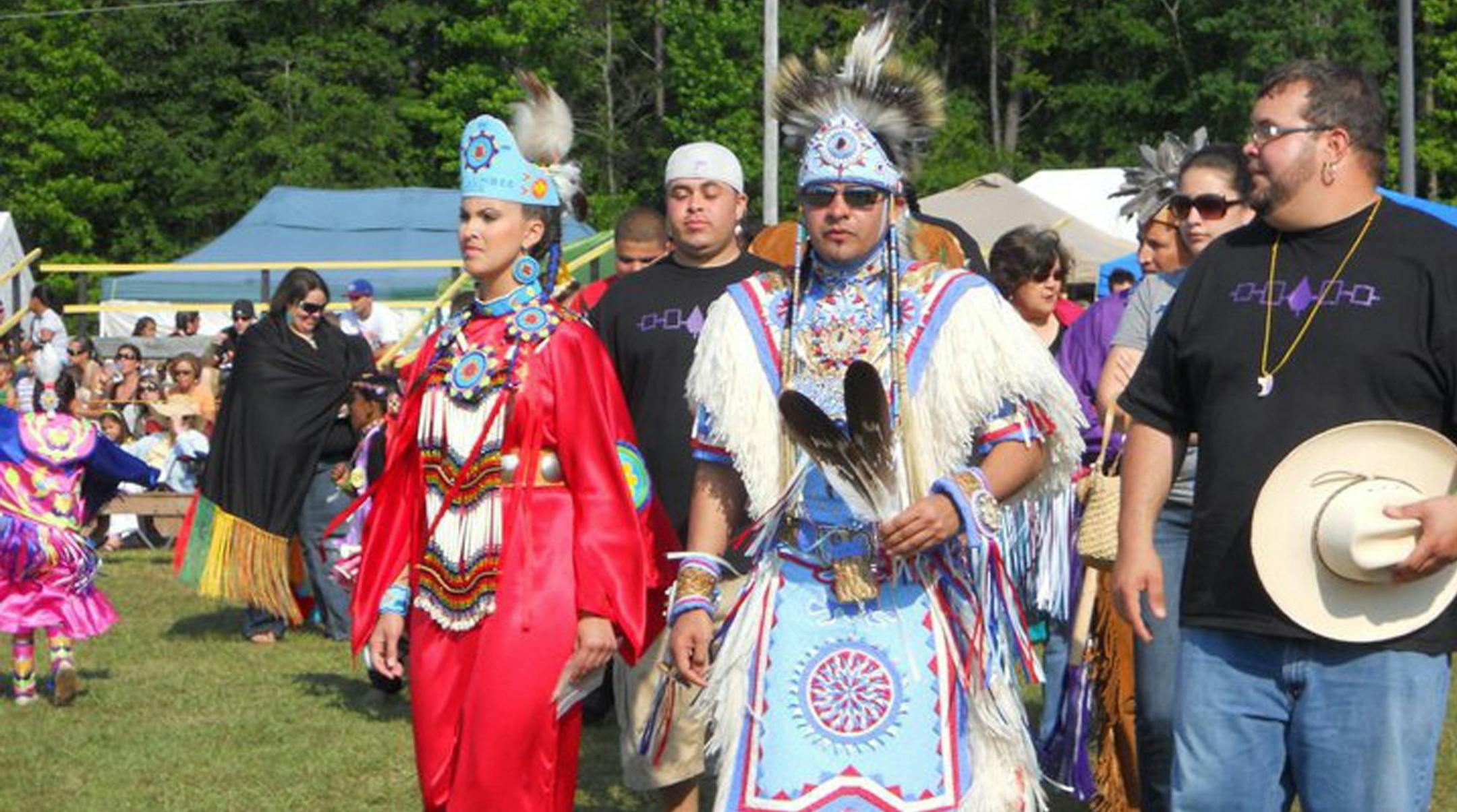 Rob Jacobs, center, a member of North Carolina&#xed;s Lumbee Tribe, wore his eagle feathers at a Lumbee powwow. Since the tribe is not recognized by the federal government, Jacobs violates the Bald Eagle Protection Act whenever he wears his feathers. Only members of federally-recognized tribes are allowed to wear the feathers for religious or cultural purposes. (Photo courtesy of Rob Jacobs/MCT) ORG XMIT: 1156030