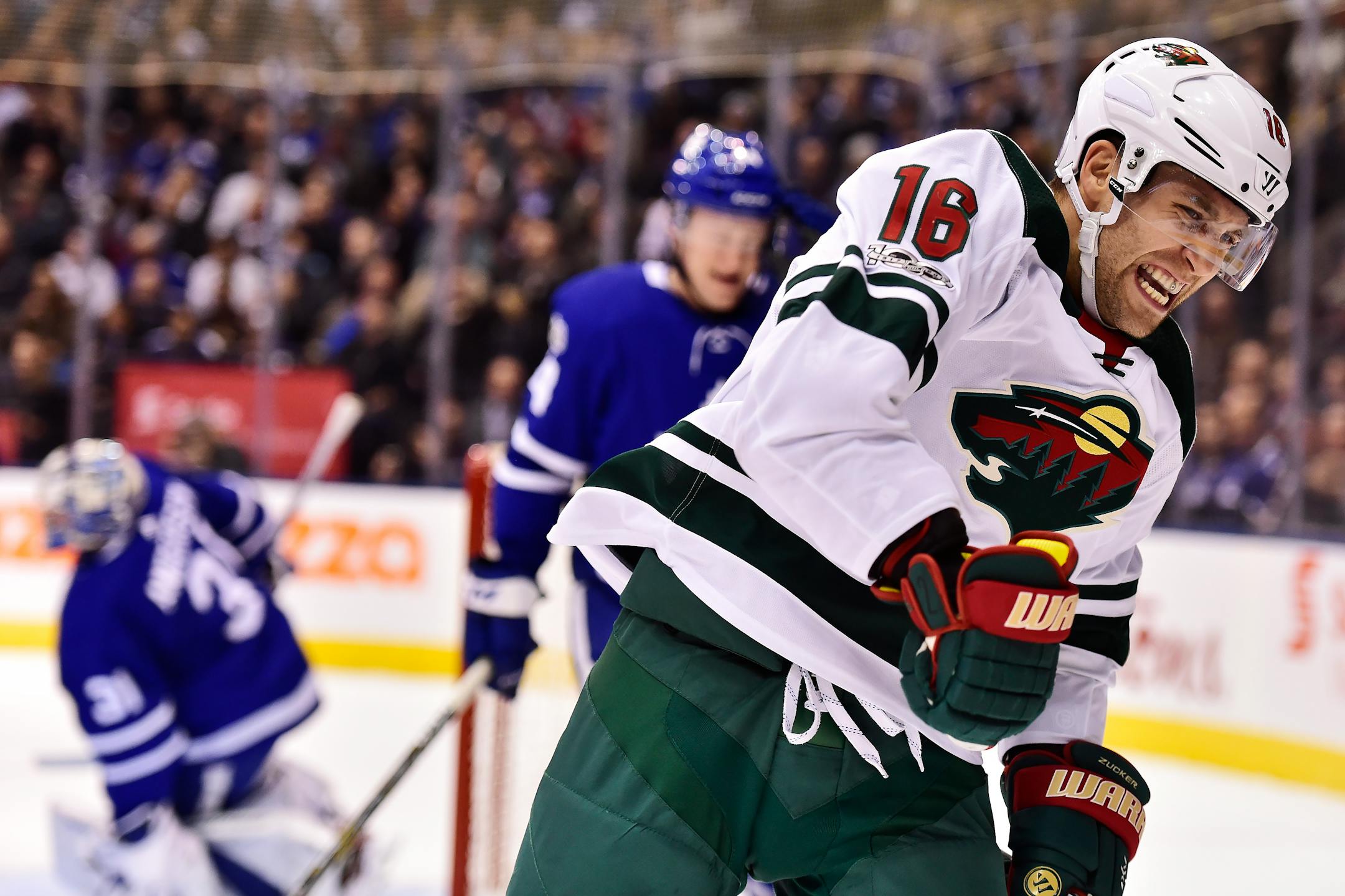 Minnesota Wild left wing Jason Zucker (16) celebrates after scoring on Toronto Maple Leafs goalie Frederik Andersen, left, during the first period of an NHL hockey game Wednesday, Nov. 8, 2017, in Toronto. (Frank Gunn/The Canadian Press via AP)