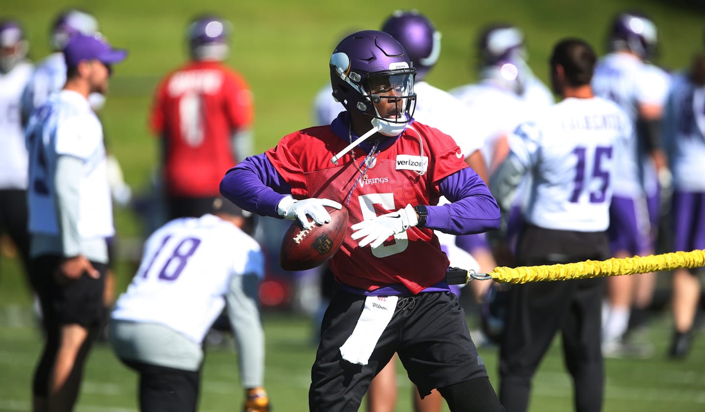 Minnesota Vikings quarterback Teddy Bridgewater worked on drills with trainer Tom Hunkele Wednesday May 31,2017 in Eden Prairie, MN.