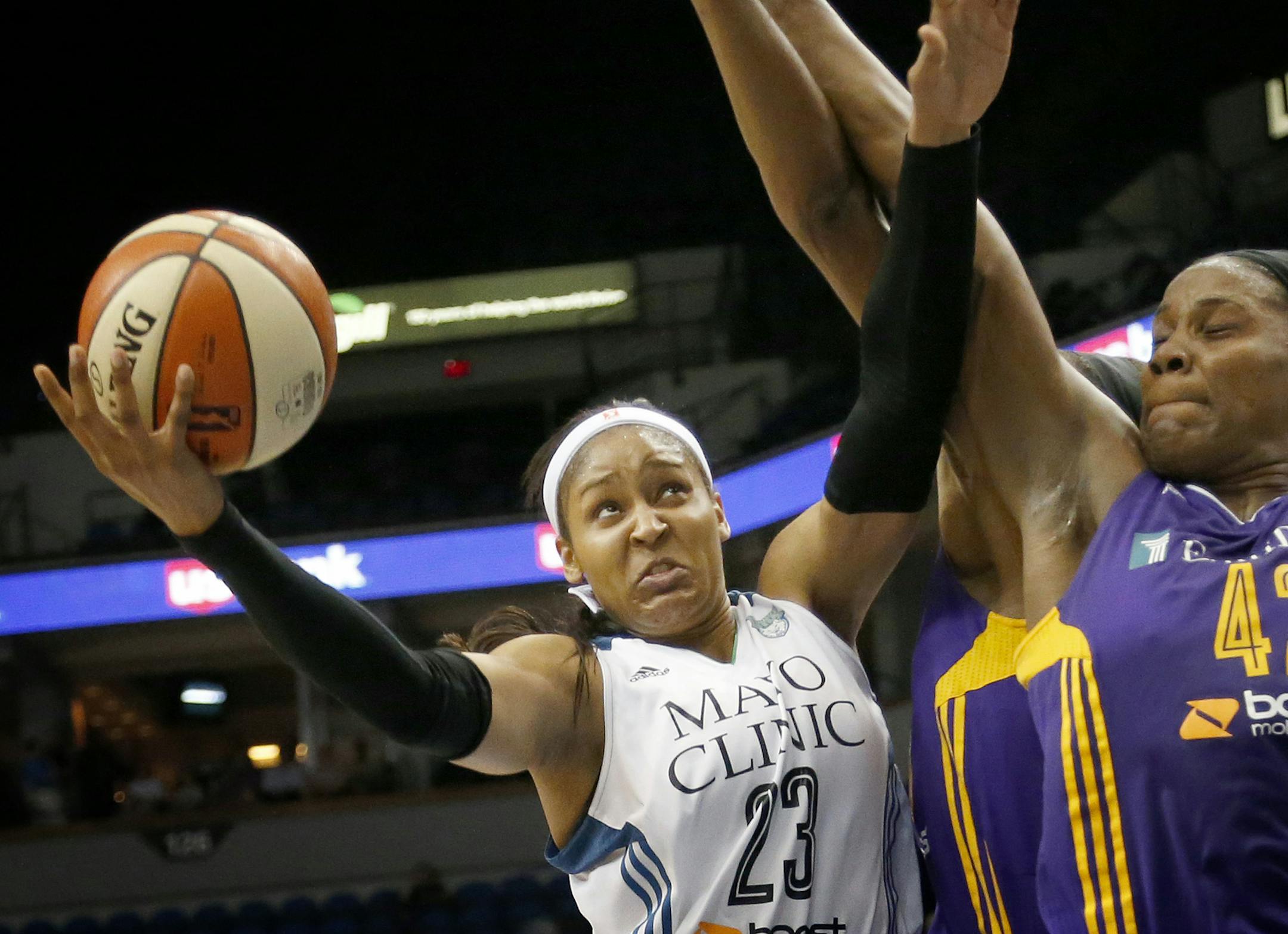 Minnesota Lynx Maya Moore (23) attempted a shot while being defended by Jantel Lavender (42) in the second quarter. ] CARLOS GONZALEZ cgonzalez@startribune.com - July 29, 2015, Minneapolis, MN, Target Center, WNBA, Minnesota Lynx vs. Los Angeles Sparks