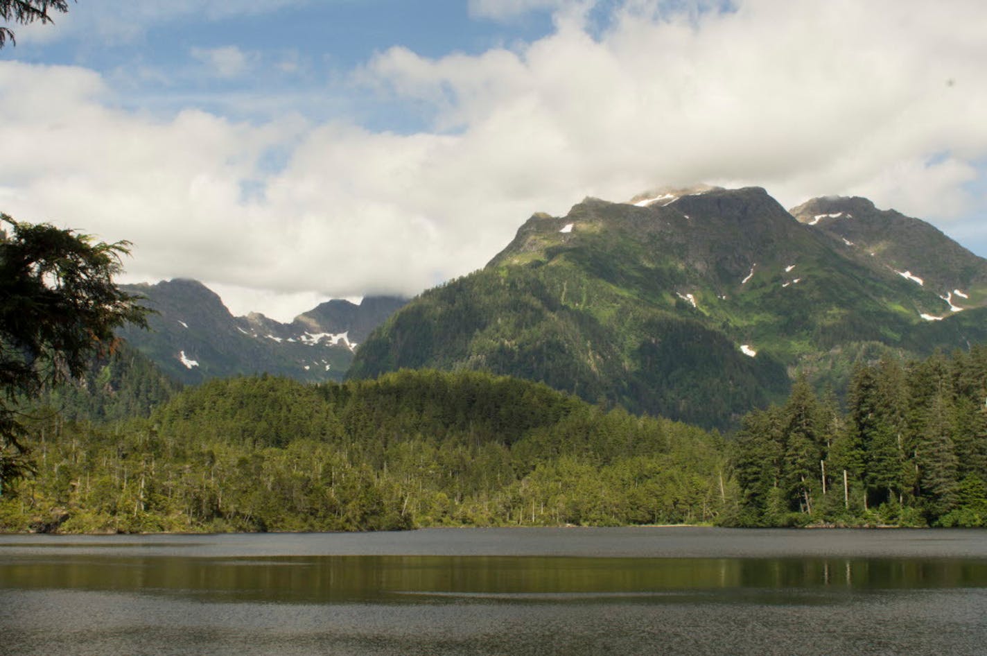 Mt. Edgecumbe frames Sitka harbor, a dormant volcano, at the southern end of Kruzof Island across the channel in the Alexander Archipelago. It is considered sacred by the Tlingit people, who calle it �L�ux� meaning, �to flash.�