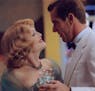 Julianne Moore (at left) and Dennis Quaid (right) star in the 2002 movie "Far From Heaven." Handout photo by David Lee, courtesy of Focus Features.