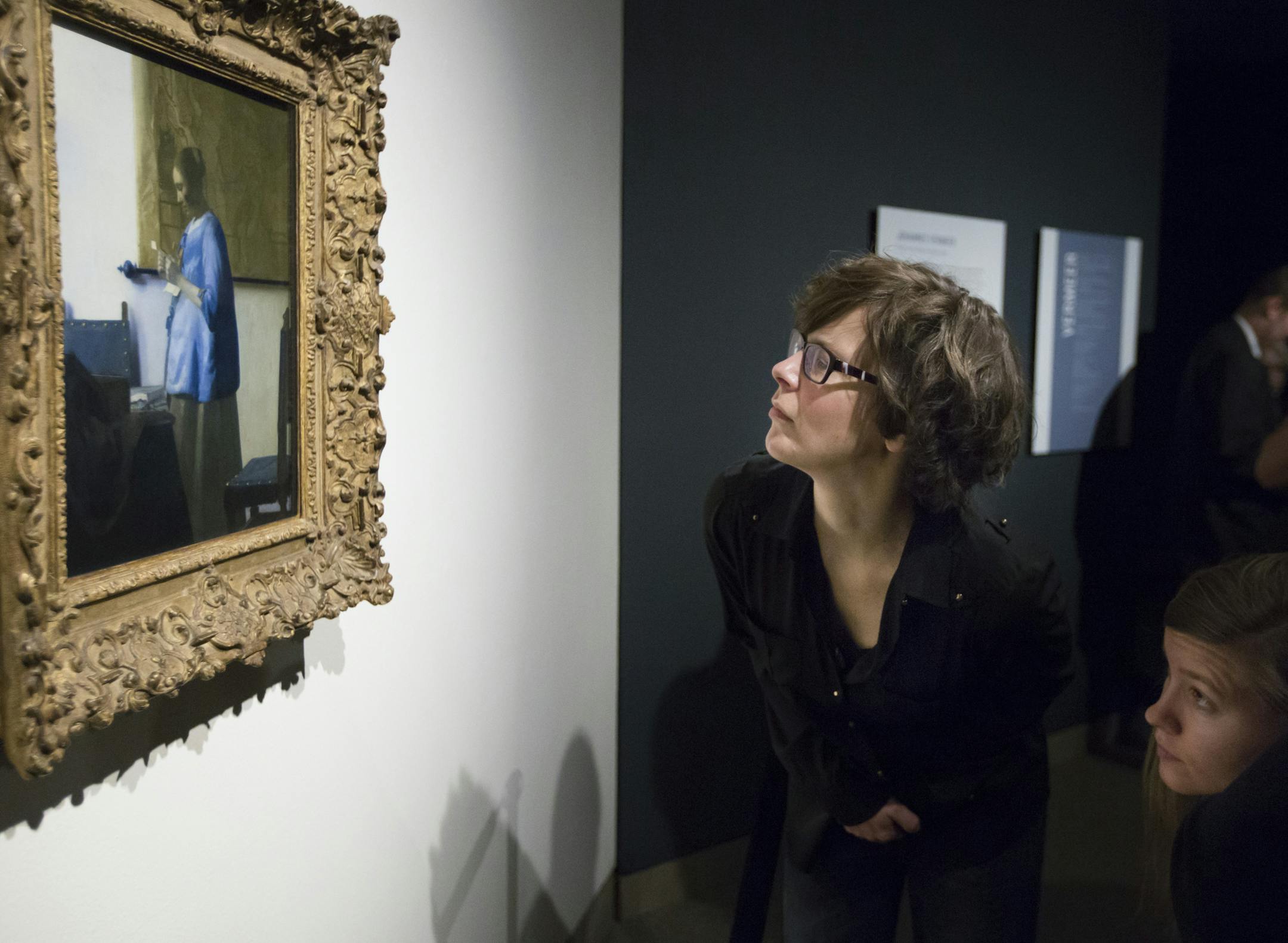 Artist and MIA tour coordinator Paula Warn got a close up look at Johannes Vermeer's Woman in Blue Reading a Letter at the staff unveiling of the Minneapolis Institute of Arts' first big "surprise" of its centennial year on Friday, January 16, 2015, in Mineapolis, Minn. ] RENEE JONES SCHNEIDER &#x2022; renee.jones@yahoo.com