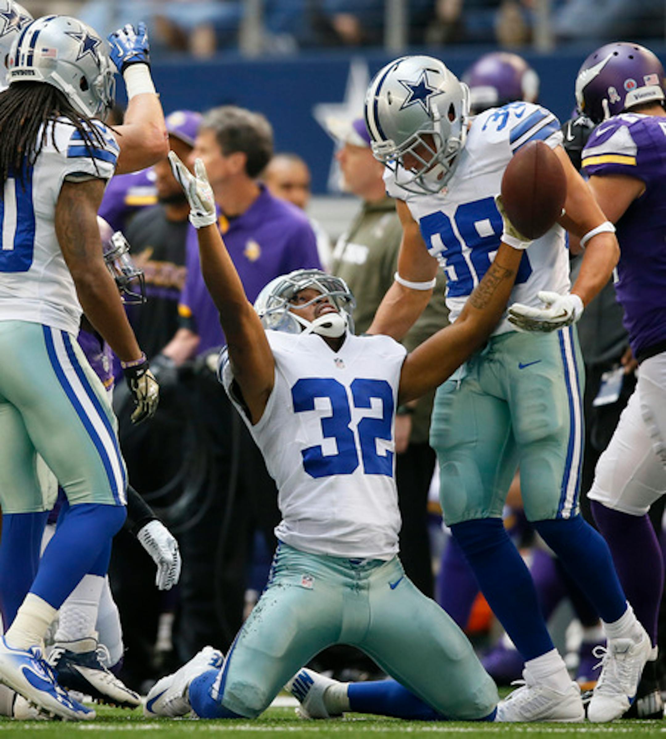 Cowboy's Orlando Scandrick celebrates his interception of a Christian Ponder pass intended for Greg Jennings in the 4th quarter. ]  Minnesota Vikings vs Dallas Cowboys, AT&T Stadium. Dallas, TX - 11/03//2013