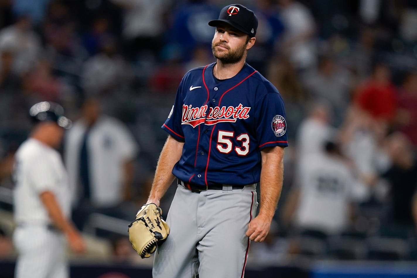 Twins pitcher Danny Coulombe waits as New York Yankees' Kyle Higashioka runs the bases after hitting a two-run home run during the fourth inning