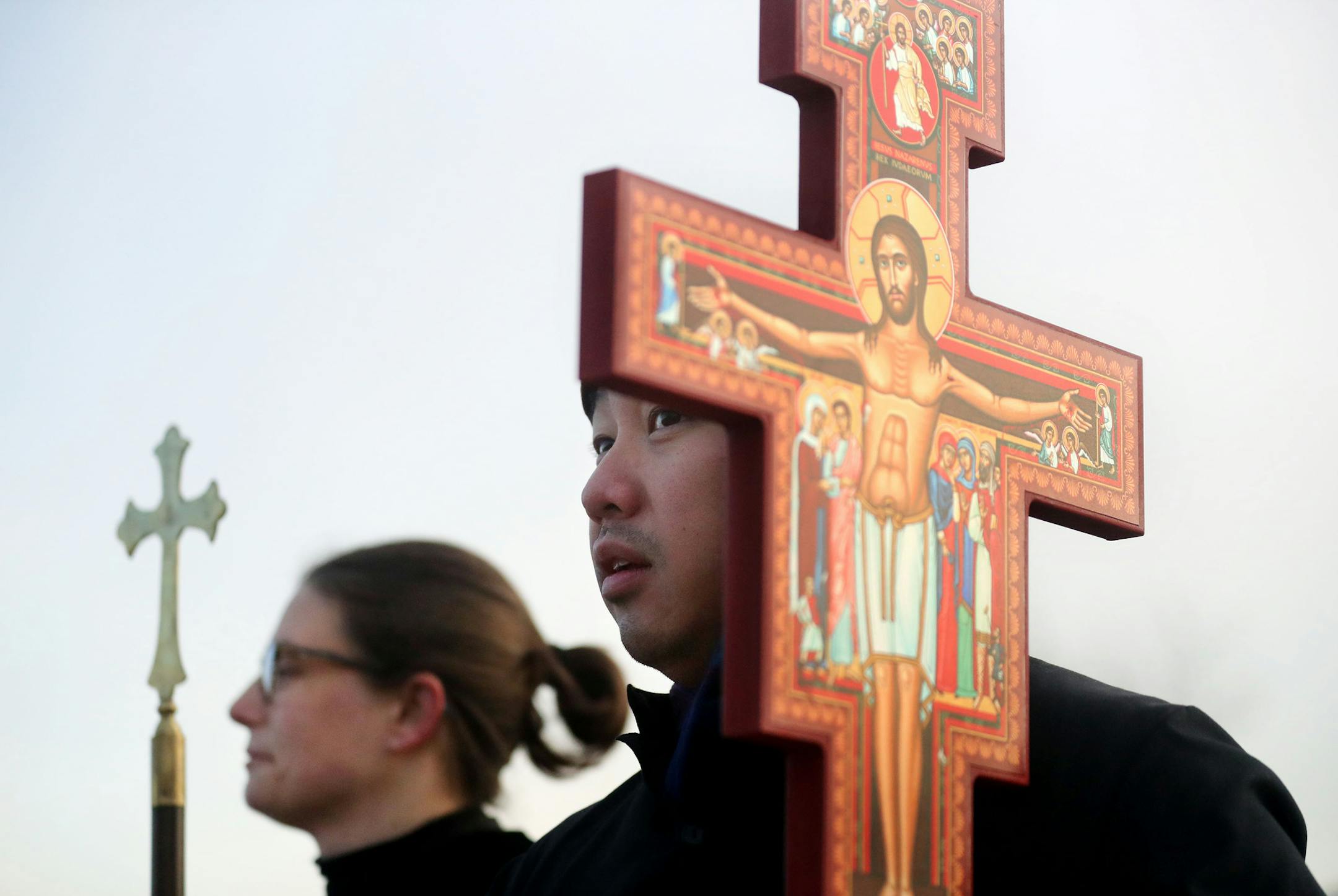 Lay person Long Kee Vang held as cross outside the Whipple Federal Building Tuesday, Oct. 29, 2019, in St. Paul, MN. Clergy and protestors gathered for a service and communion outside the Whipple Federal Building and to protest the naming of the building after the Episcopal bishop because deportations and other actions at the courthouse are in opposition to the beliefs of the Episcopal church, they stated.] DAVID JOLES &#x2022; david.joles@startribune.com Immigration activists and the Episcopal