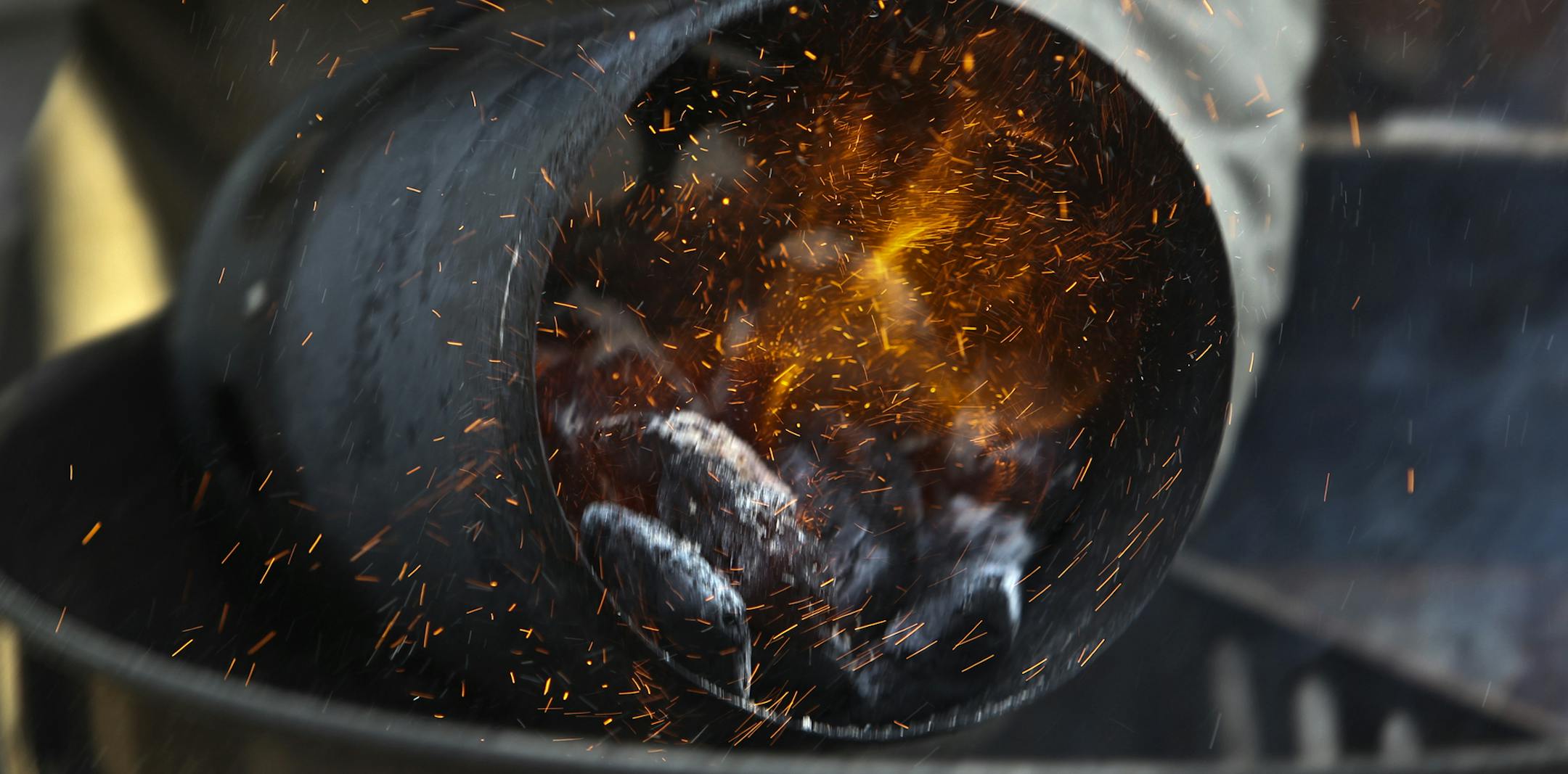 Fresh coals are added for smoking a turkey during Smokapalooza 2013, on the deck of the Pupel family residence Saturday, May 26, 2013 in Plymouth, MN.](DAVID JOLES/STARTRIBUNE) djoles@startribune How do you learn the intricacies and nuances of user a smoker? By having lots and lots of experiments going on at one time. How do you do that? By gathering 10 families, smokers and grills at the ready, for Smokapalooza. Everyone learns, by successes and failures, and they eat really well. More than 200