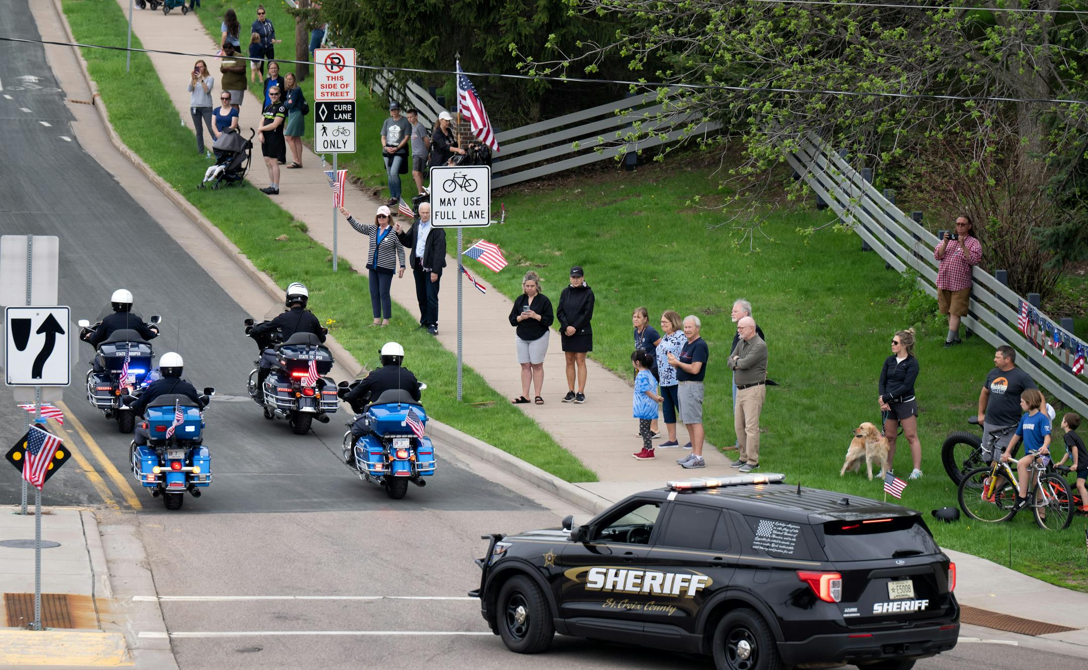 Kaitie's squad vehicle, right, was the lead vehicle in the procession.  Over a thousand law enforcement officers from around the U.S. gathered for Funeral services for St. Croix County Sheriff's Deputy Kaitie Leising who was shot and killed on Saturday evening Friday, May 12, 2023  Hudson, Wis.