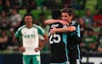 Minnesota United FC midfielders Alejandro Bran (25) and Wil Trapp (20) celebrated as time expired on the Loons' 2-1 season-opening victory last Saturd