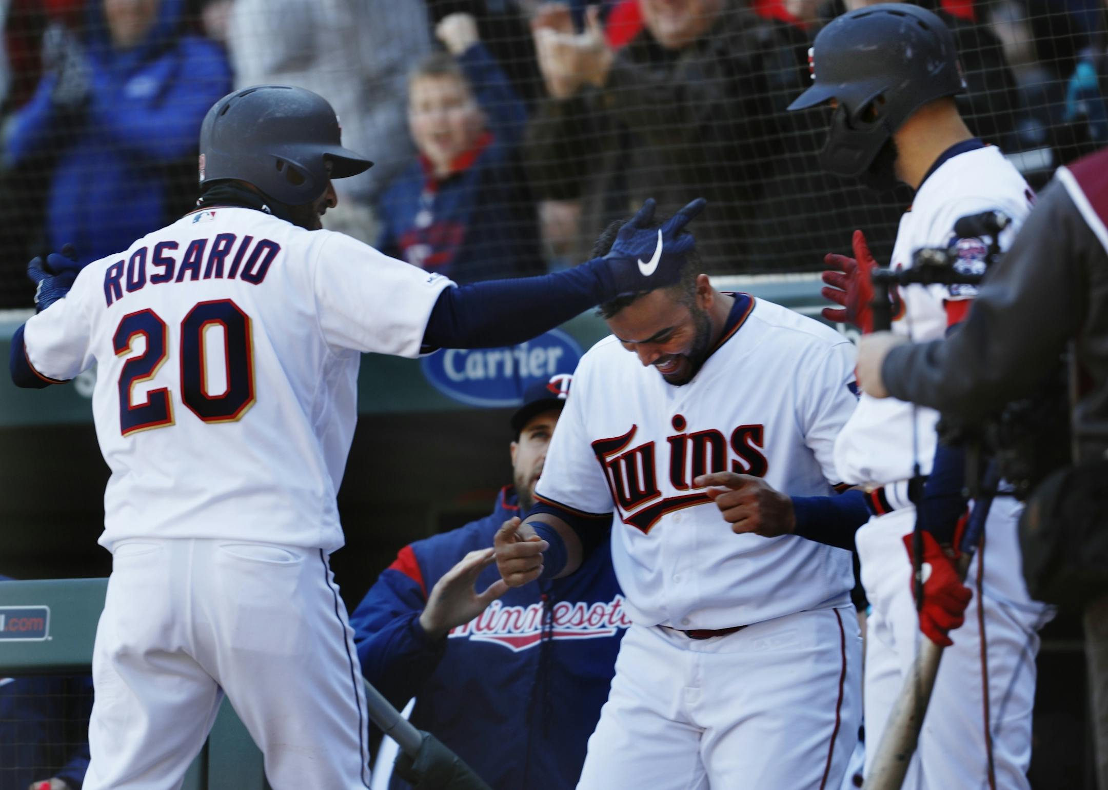 Eddie Rosario (20) celebrates his home run in the seventh inning.
