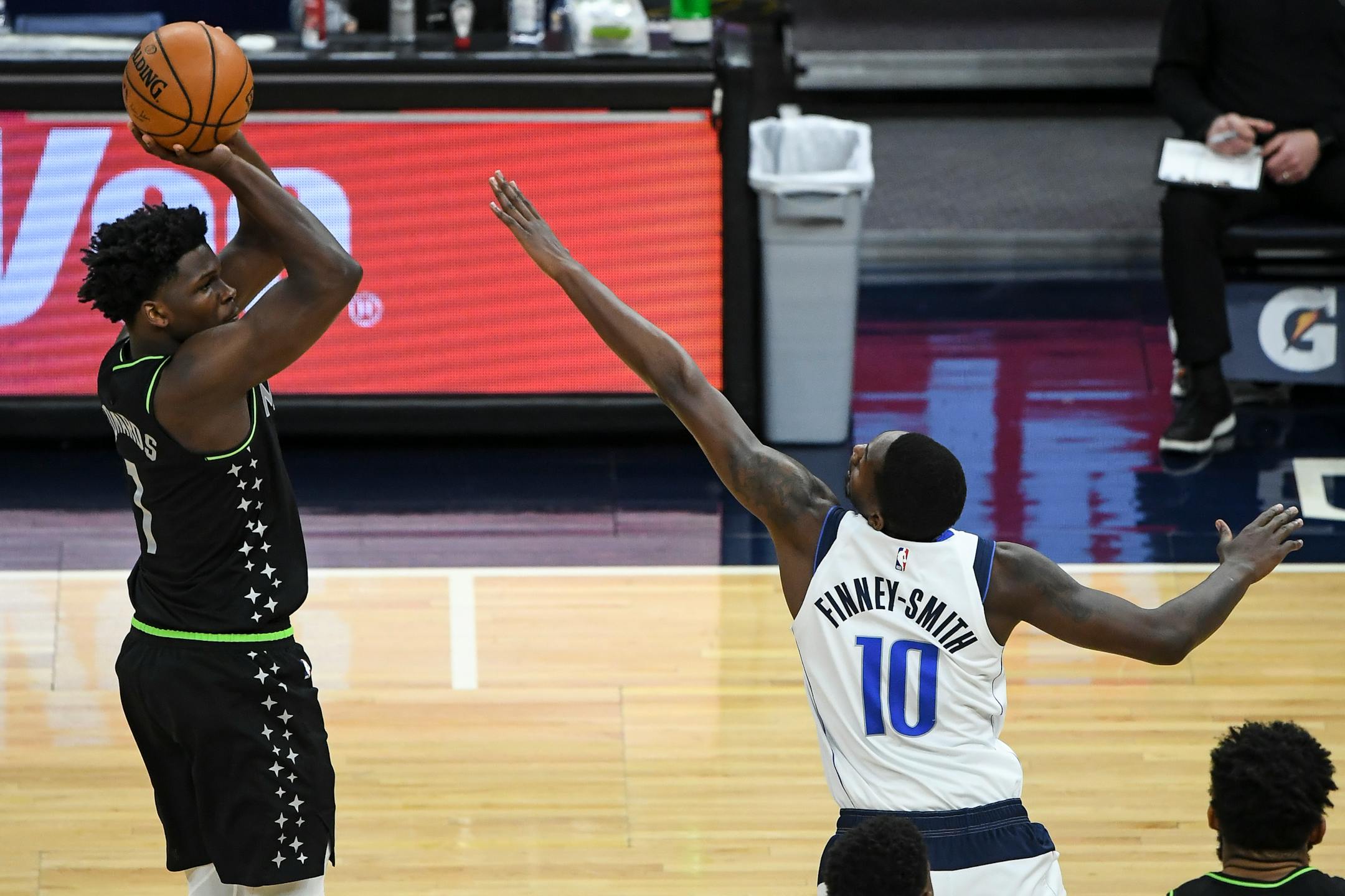 Minnesota Timberwolves forward Anthony Edwards (1) scored a 3-pointer in the first quarter as he was defended Byron Dallas Mavericks forward Dorian Finney-Smith (10).