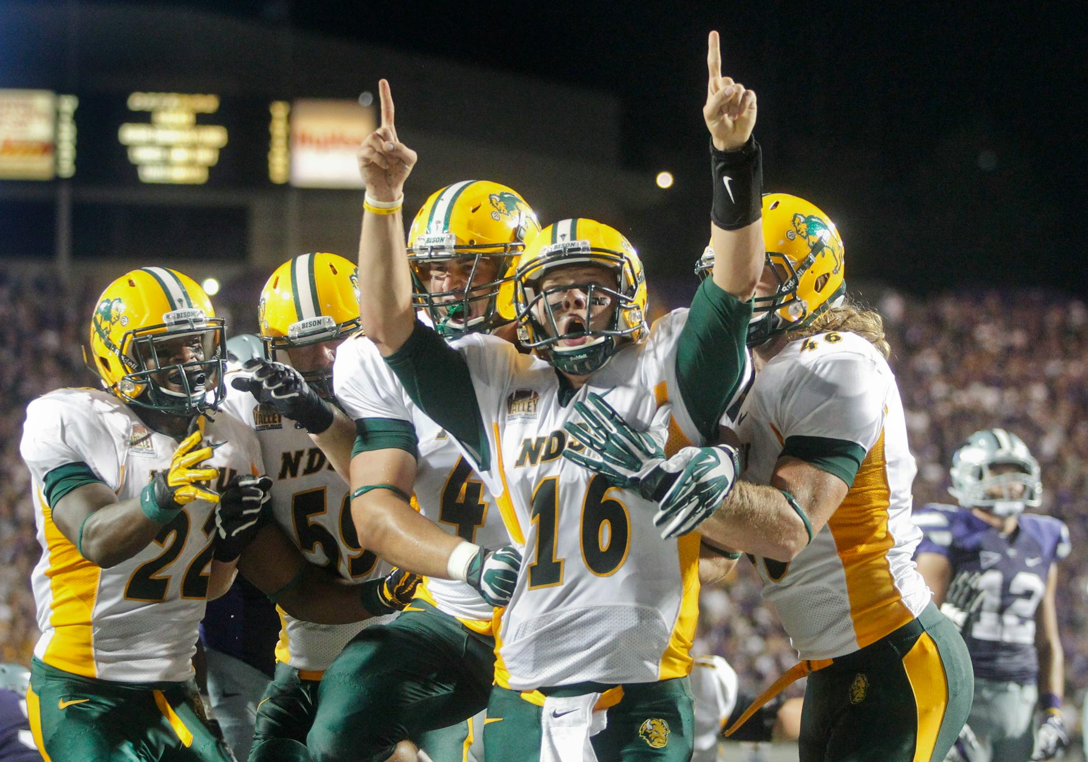 North Dakota State quarterback Brock Jensen let out a scream as his teammates rejoiced with him after scoring with 28 seconds left in the fourth quarter for the winning touchdown in a 24-21 victory at Kansas State