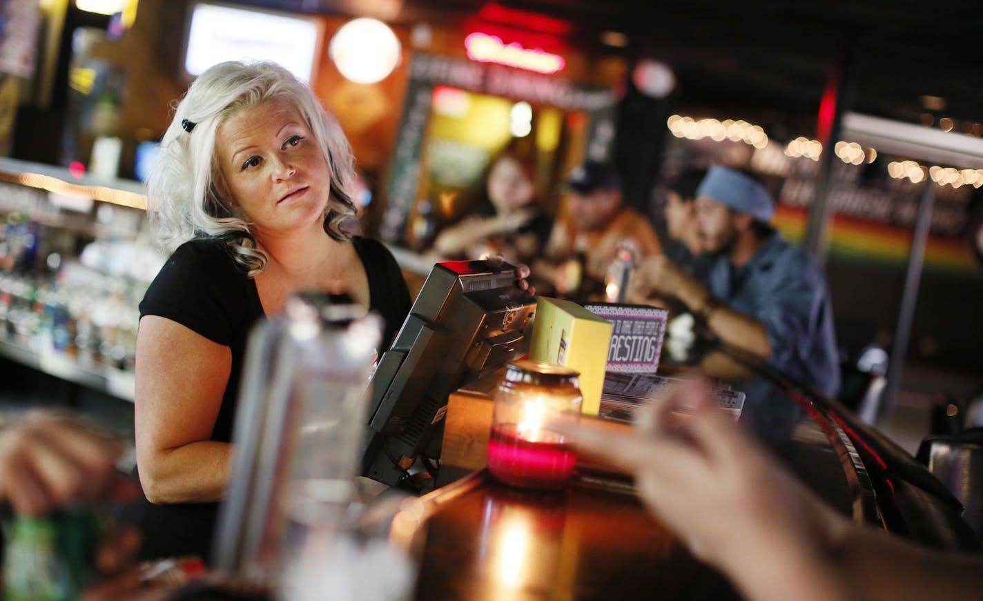 Sonya Fry, owner of the Dalles House, waited on customers at her bar in St. Croix Falls, Wis. She is concerned how the shutdown national park will affect business.