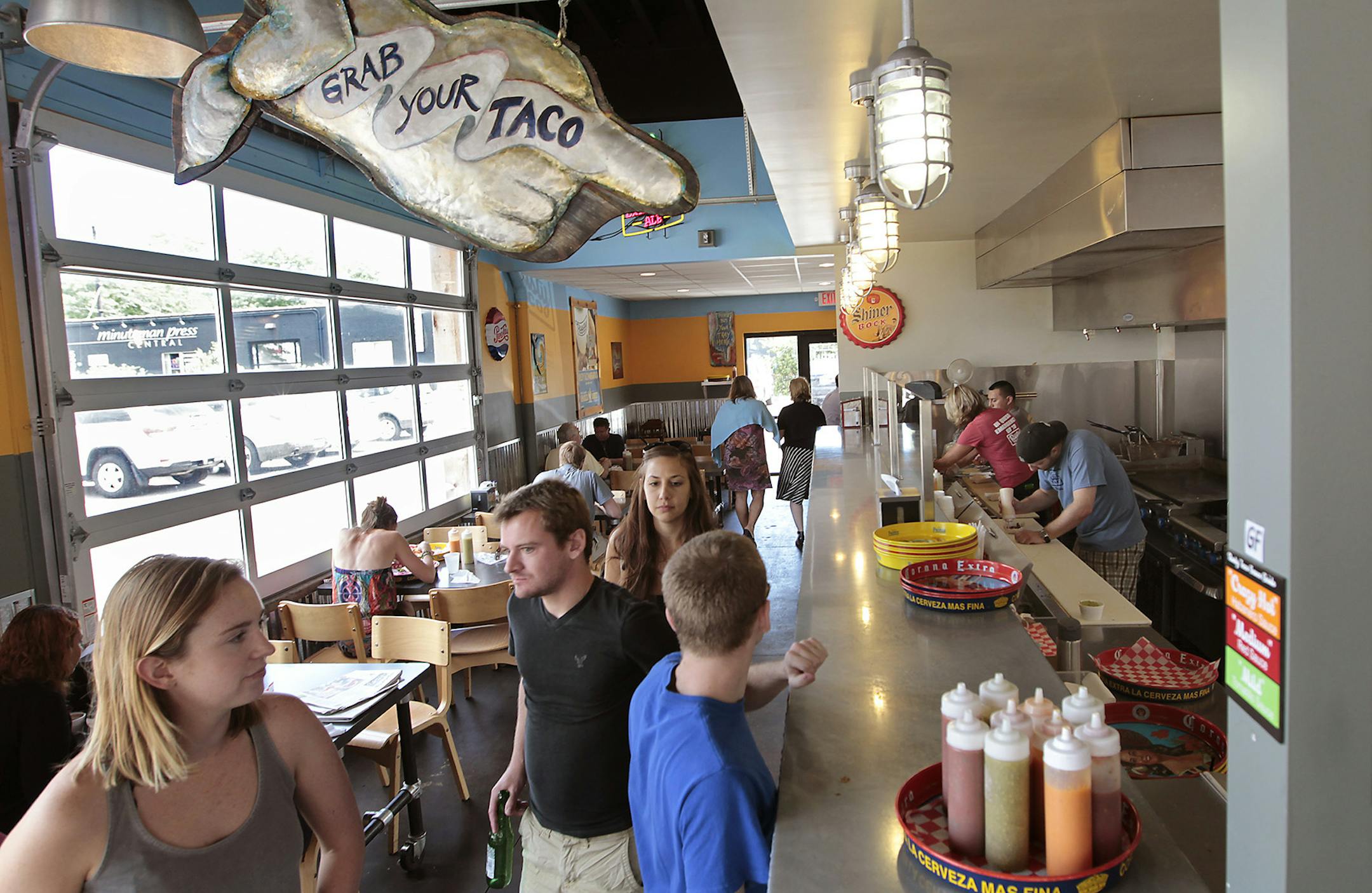 Patrons waited for their orders at Rusty Taco in Minneapolis on Monday. The chain has nine outlets nationwide, three of them in the Twin Cities.