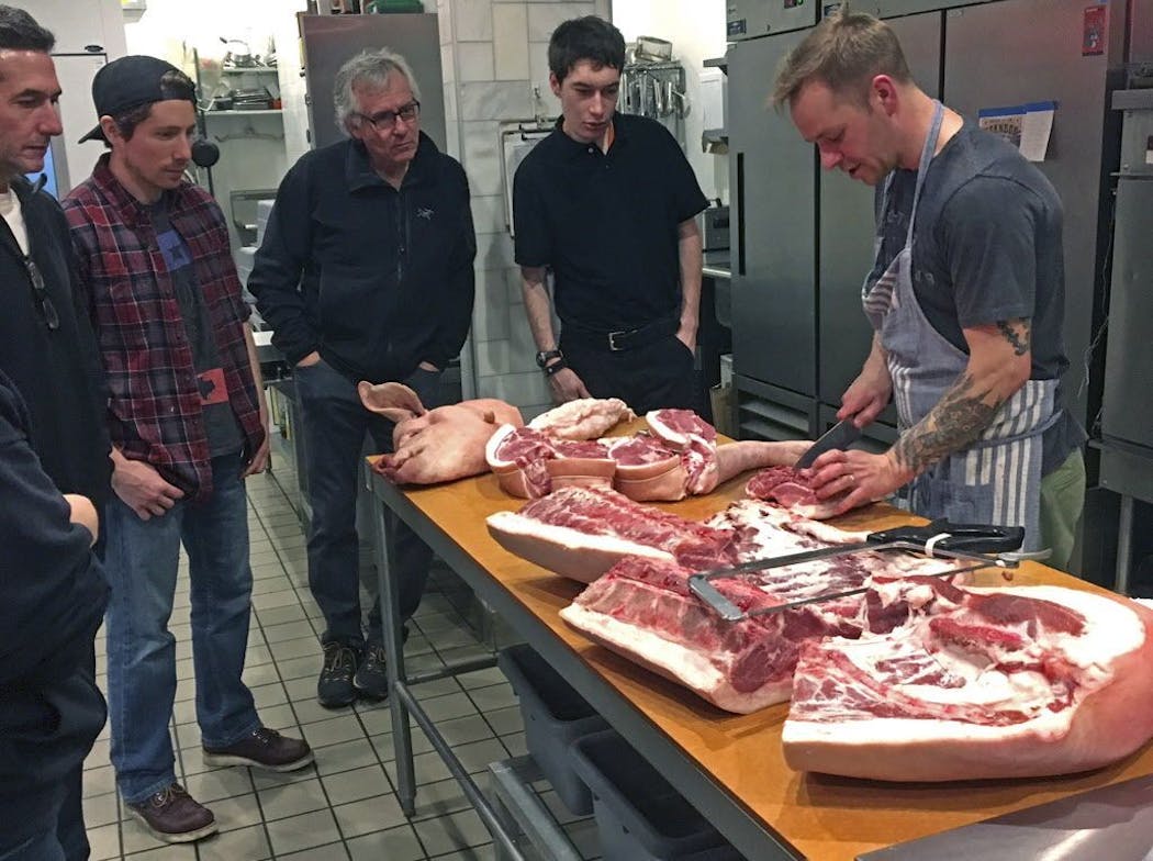 Owner/butcher Erik Sather gives a peek inside the monthly hog butchering class at Lowry Hill Meats.