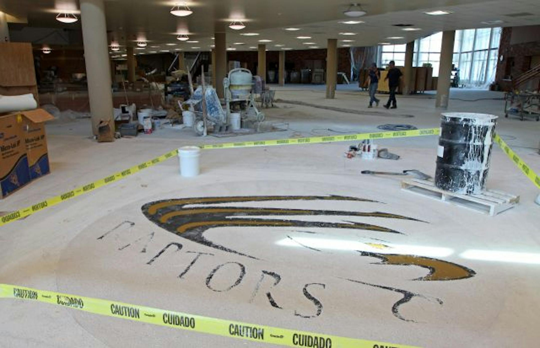 A truly grand opening: The raptor school logo was being installed in the $95 million East Ridge High School in Woodbury. School district officials say they envision the school also serving as a community and event center.
